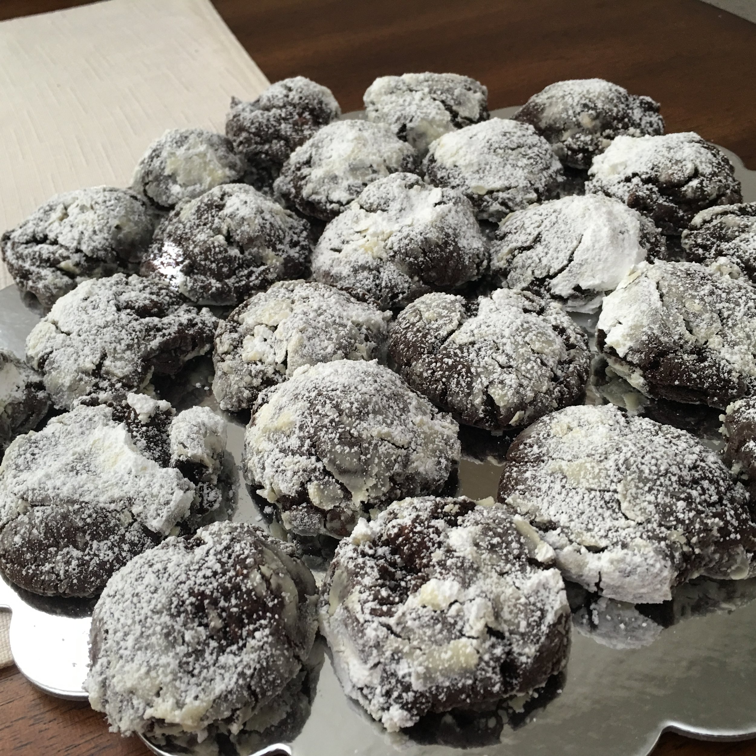 Soft Chocolate Crinkle Cookies.  Garnished with Powdered Sugar