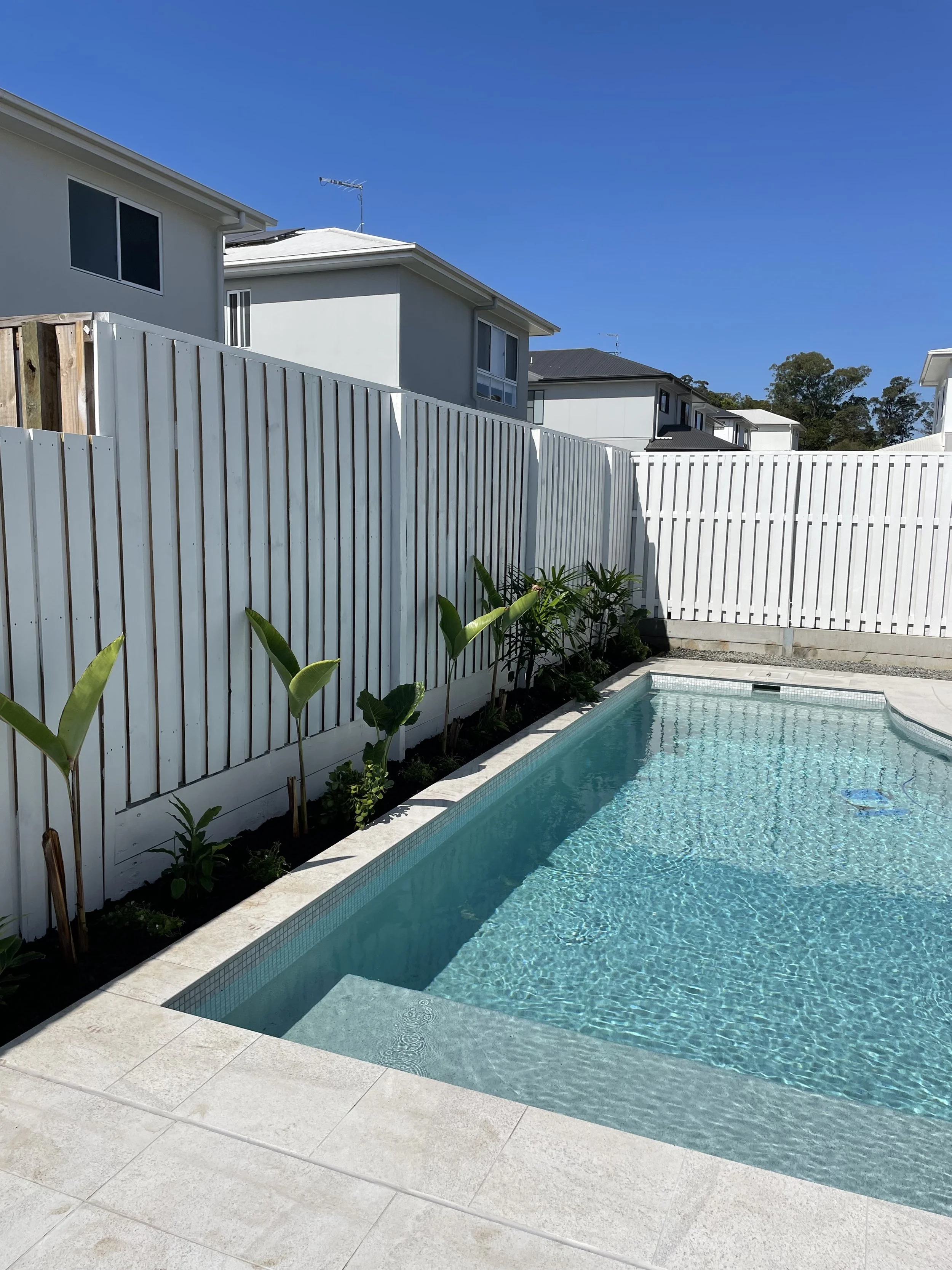 Custom-built elevated swimming pool with poolside pavilion - Brisbane landscaping project