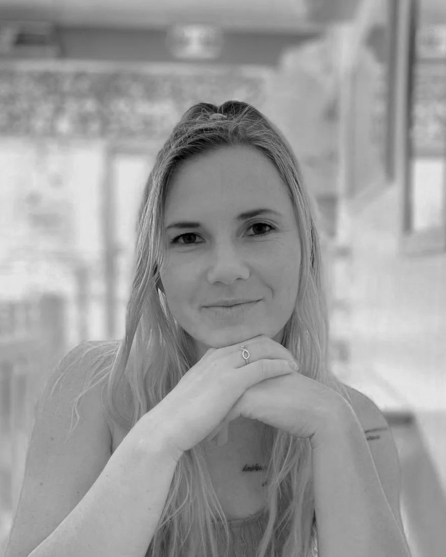 Professional headshot of Valarie Hope, landscape design and construction specialist in Brisbane, Australia, standing outdoors with a garden backdrop.