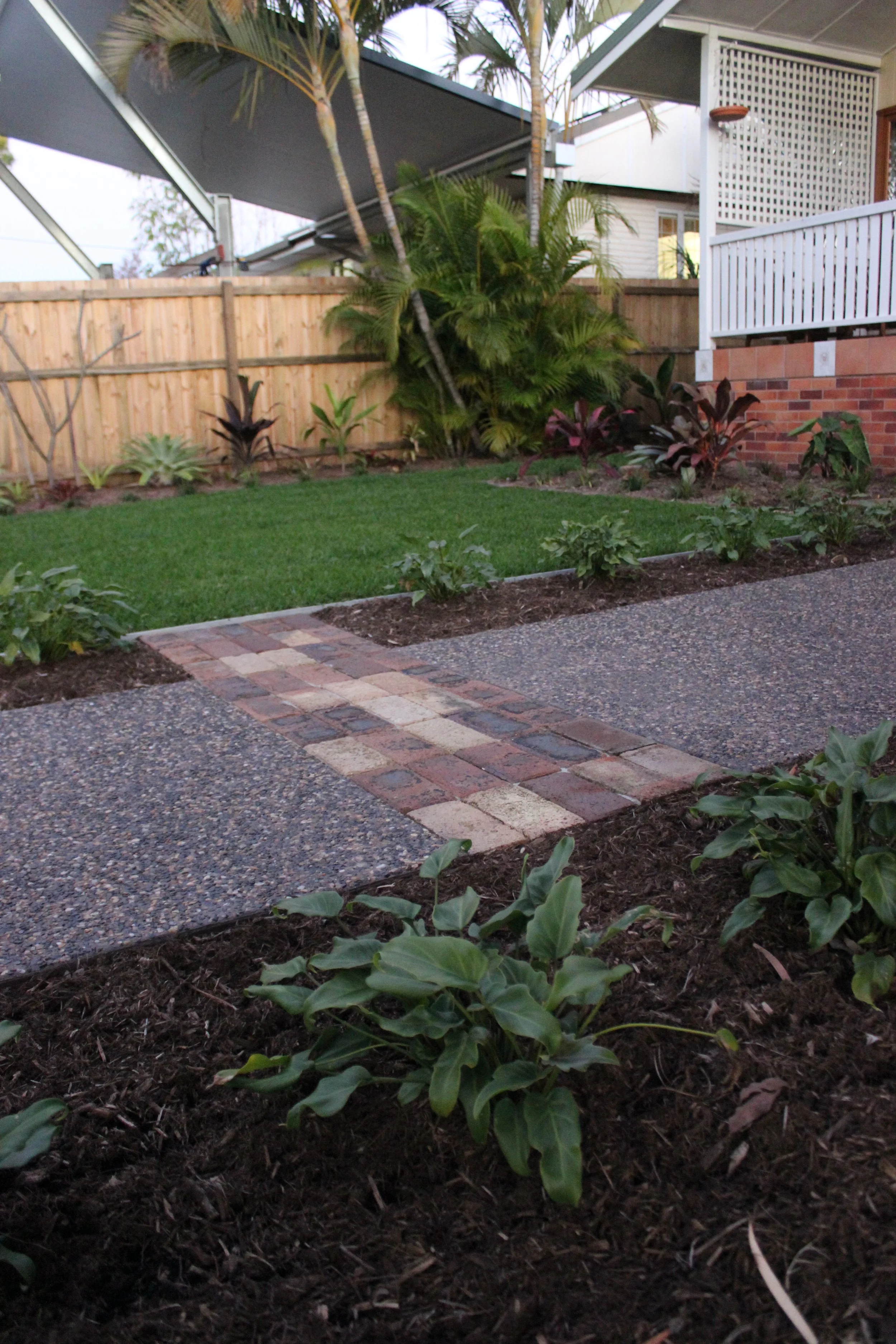 Custom-built front yard with sliding driveway gate - Brisbane landscaping project