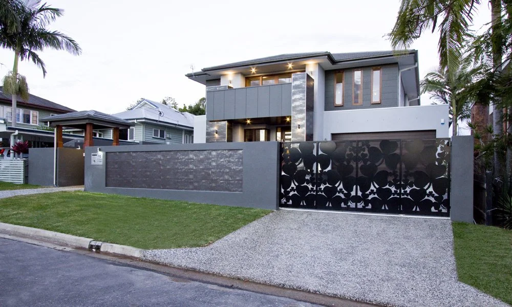 Custom-built front yard with sliding driveway gate - Brisbane landscaping project