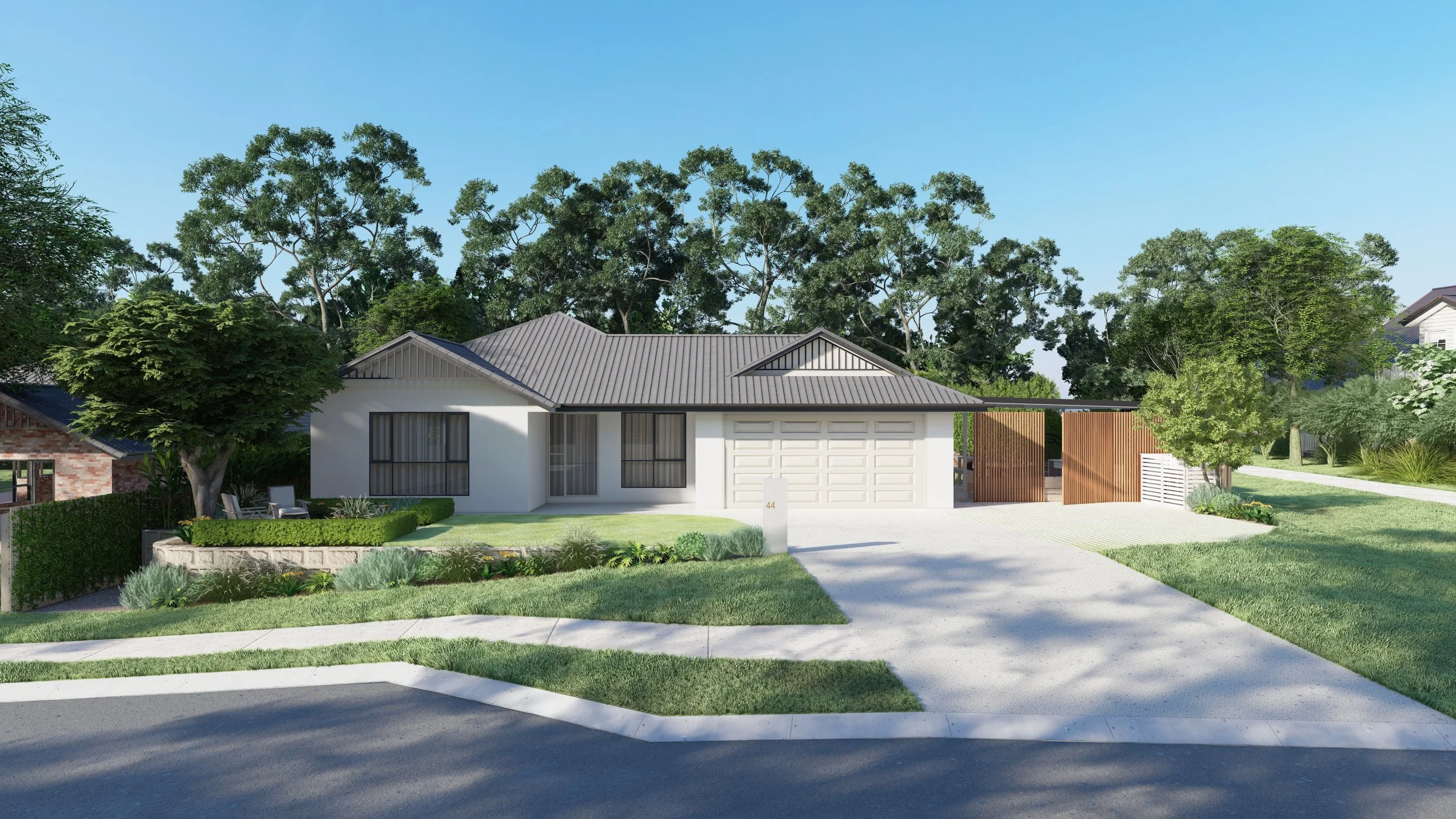 Modern single-story white house with gray roof, front yard with lawn and landscaped garden, driveway leading to a double garage, and trees in the background under a clear blue sky.