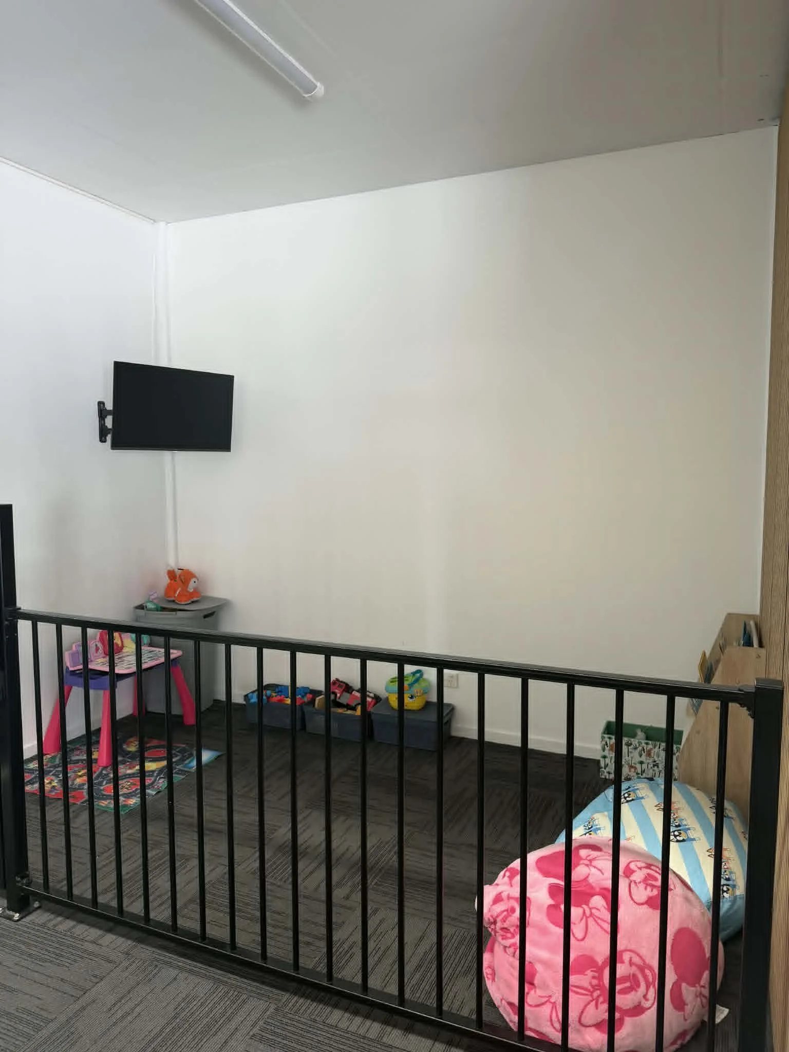 Childminding area. With gate, televsision, kid friendly toys.