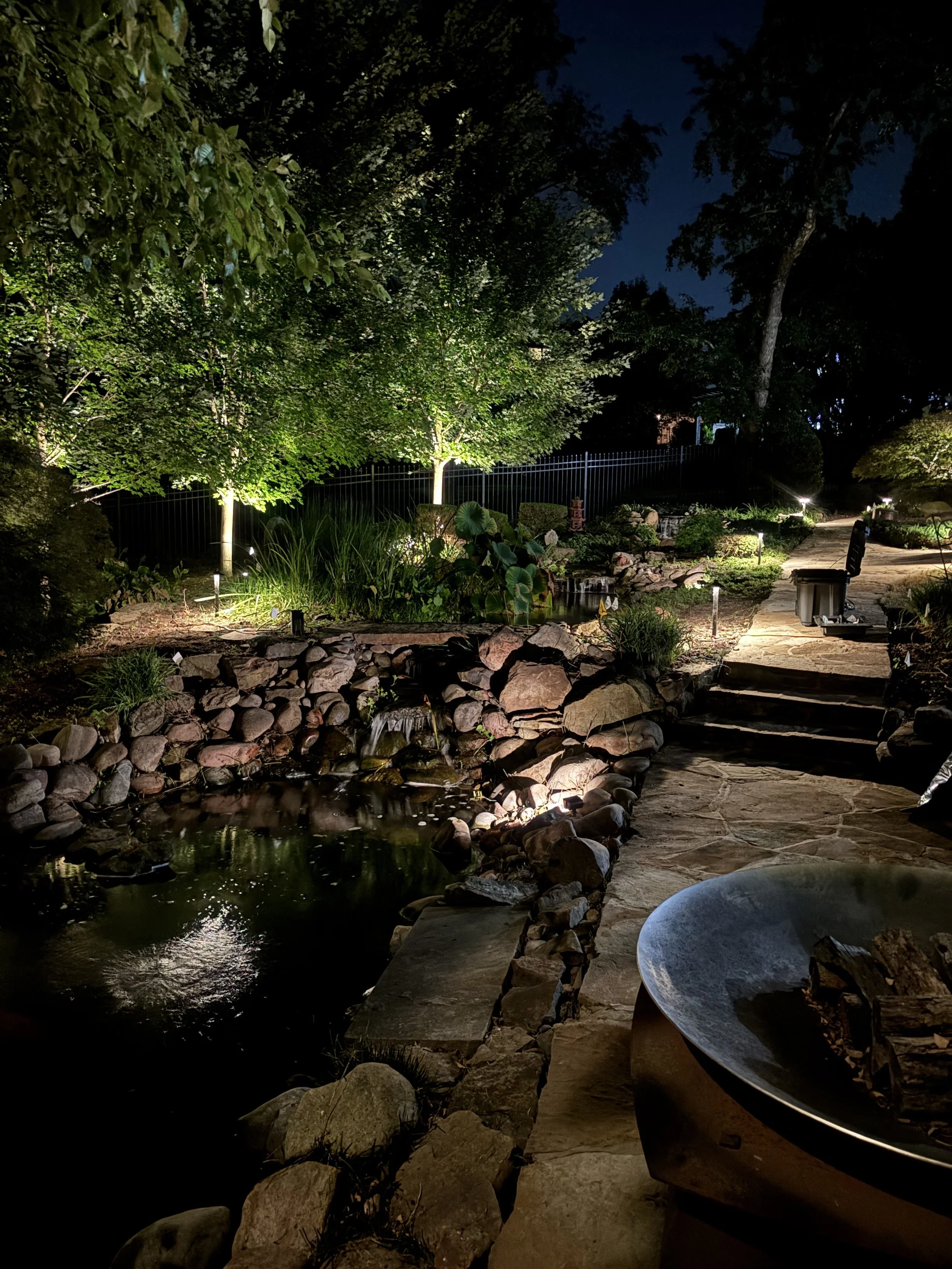 Designing Backyard Landscape Lighting Around a Koi Pond in Bentonville, Arkansas