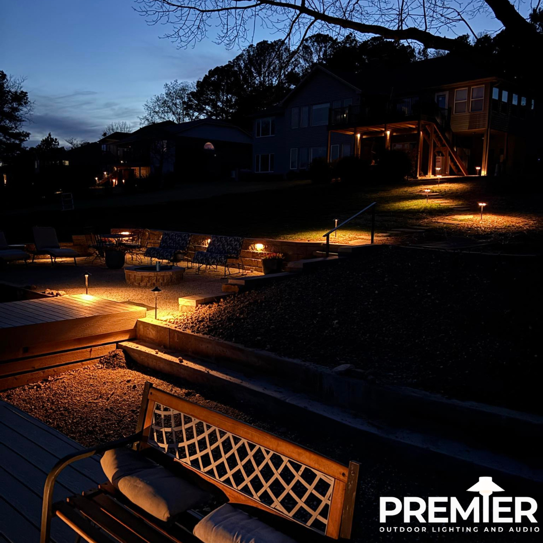 Lakefront Airbnb landscape lighting installation at Lake Loch Lomond in Bella Vista AR featuring deck lights and tree uplighting by Premier Outdoor Lighting
