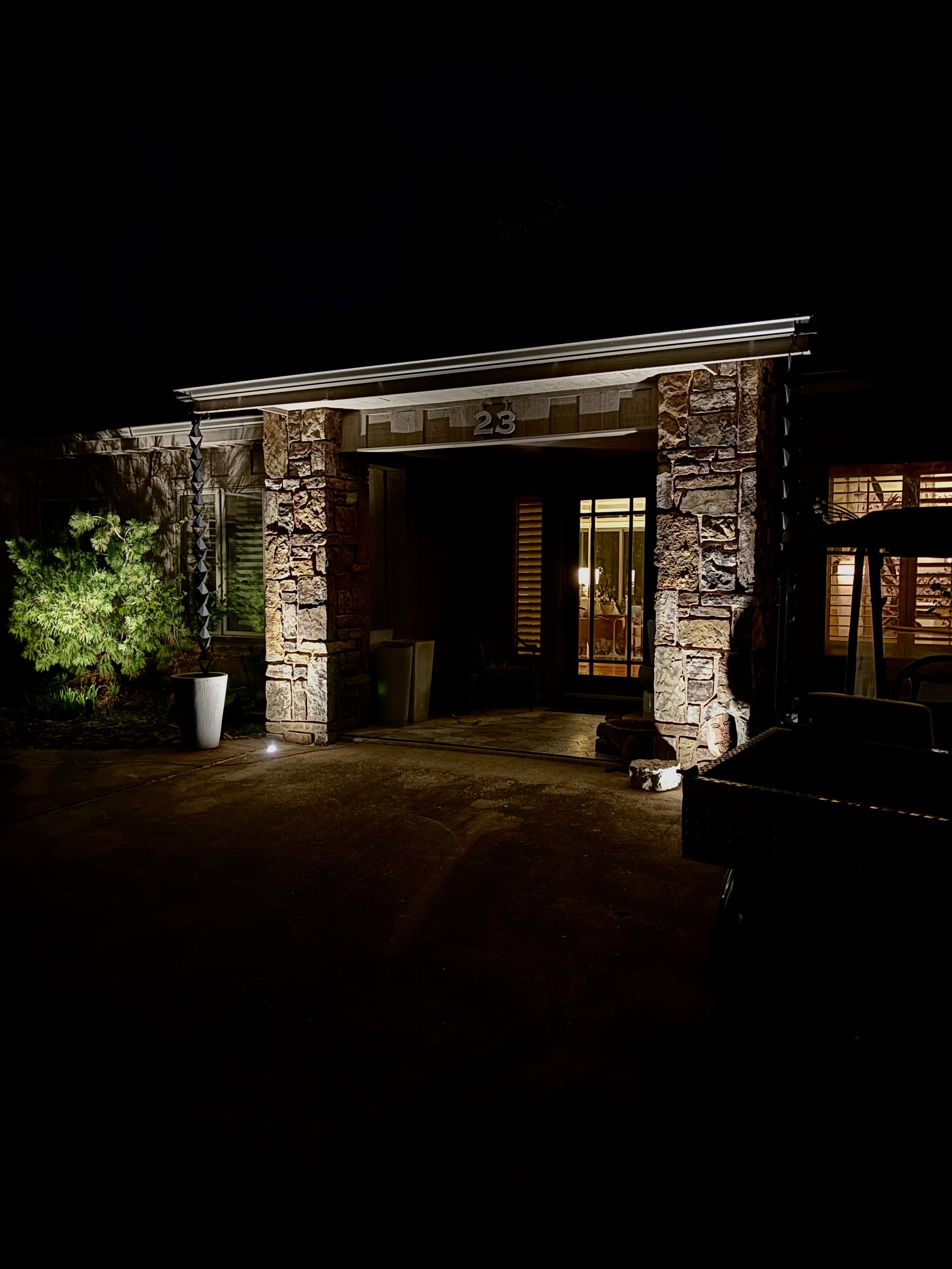 Welcoming home entrance with professional outdoor lighting illuminating walkway and front door.jpeg