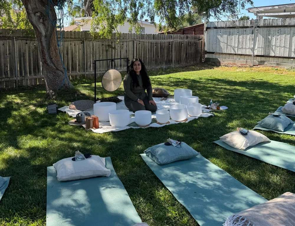 Liz preparing an outdoor sound ceremony with crystal bowls