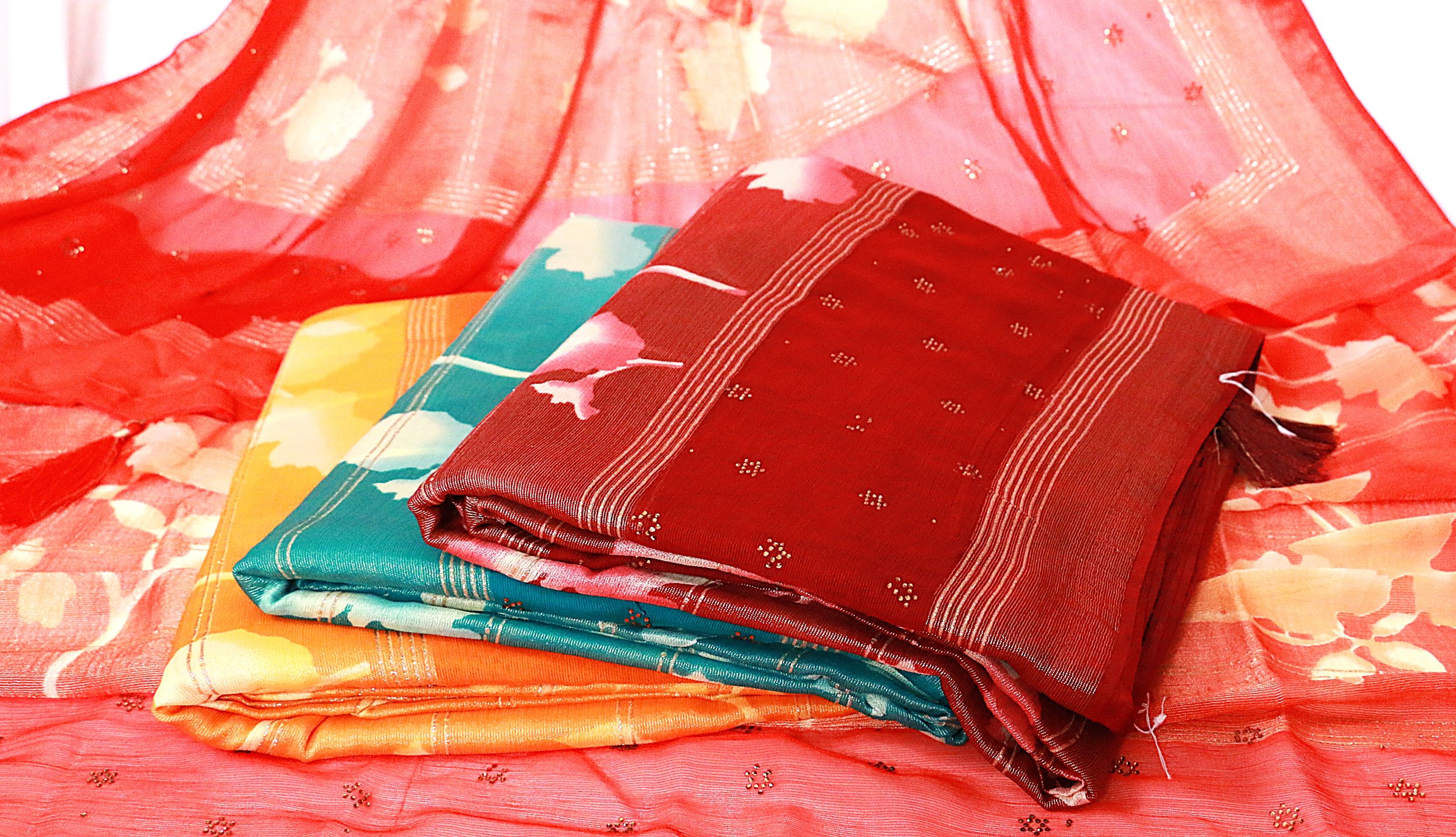 The Sitara Rang Georgette Saree is a graceful blend of softness and subtle sparkle. Crafted in airy georgette, it features delicate motifs and harmonious colours that create an effortless festive look.