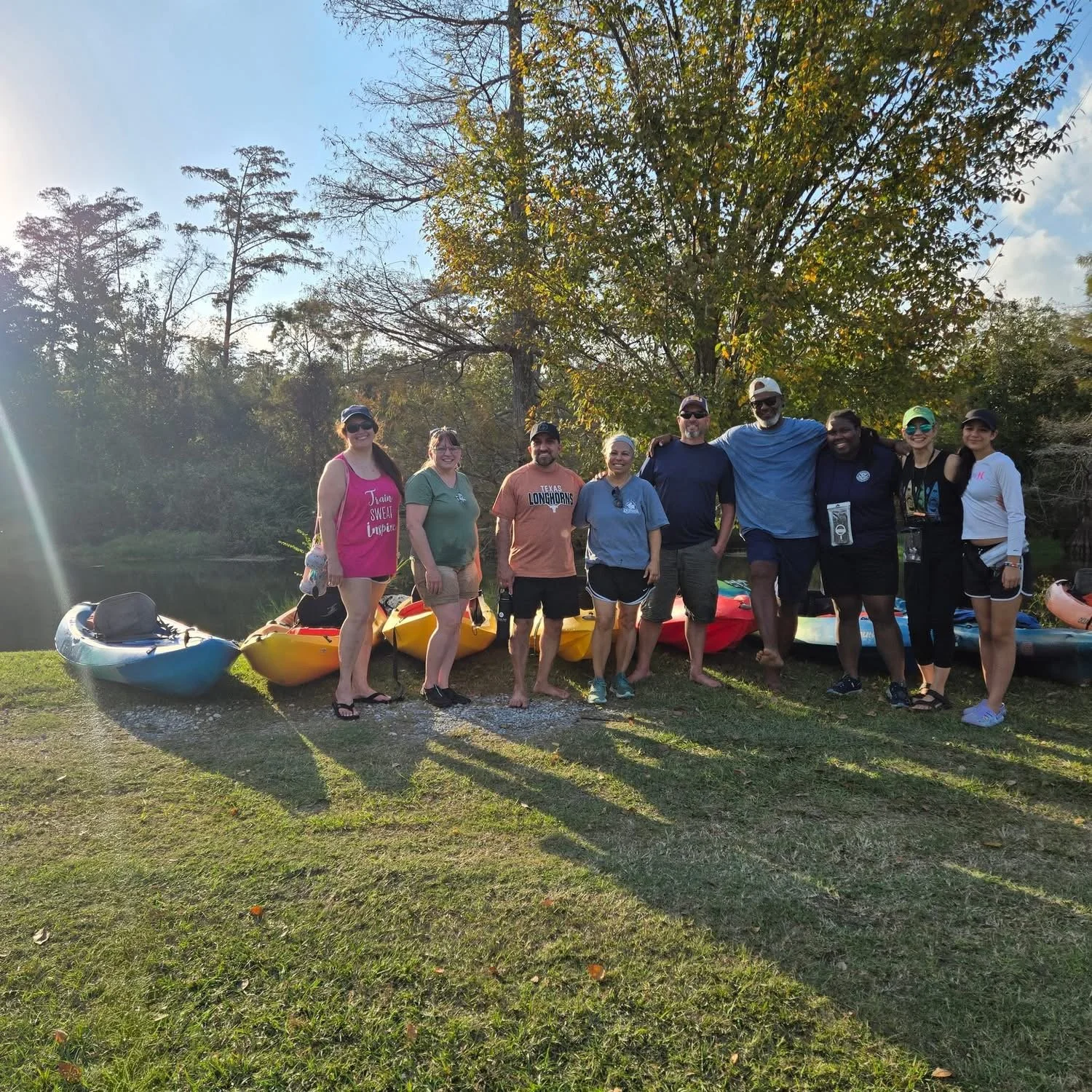 two paddlers enjoy a tandem kayaking experience on calm waters near Lake Charles, LA. Bayou Glamping Co. offers kayak rentals, tours, glamping, outdoor adventures showcasing SWLA's natural outdoor beauty.