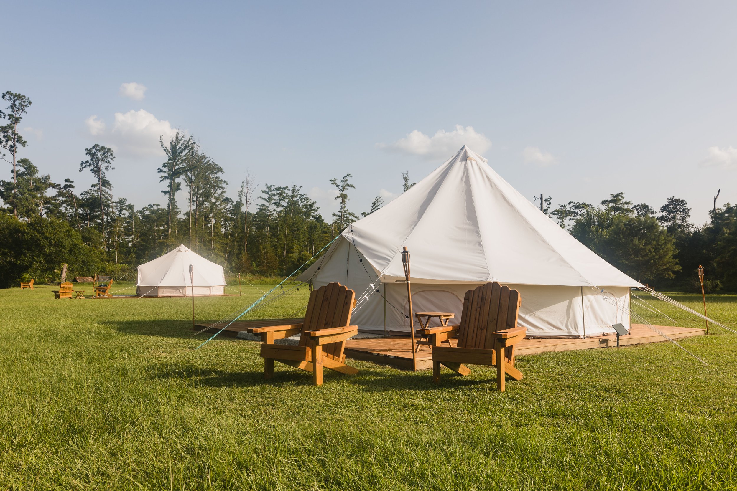 Luxury canvas glamping tent at Bayou Glamping Co. in Southwest Louisiana, offering a unique outdoor getaway with modern comforts and scenic surroundings.