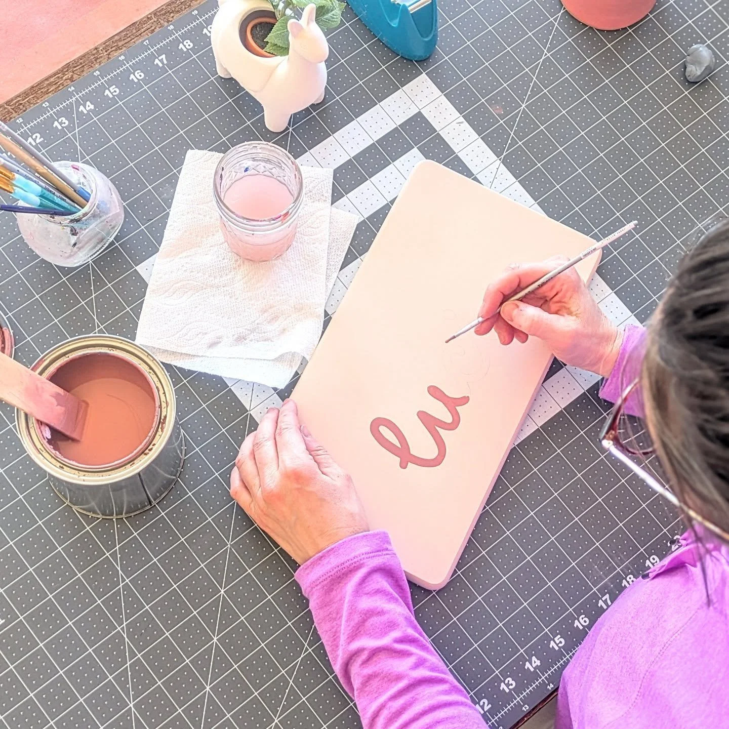 ✨ Hand-painting magic in the heart of Sandia Heights, NM! 🏜️ This custom toddler step stool for Lucie (how adorable is that spelling?!) is headed to New York City to brighten up her little corner of the world. 💕 Every brushstroke is a labor of love