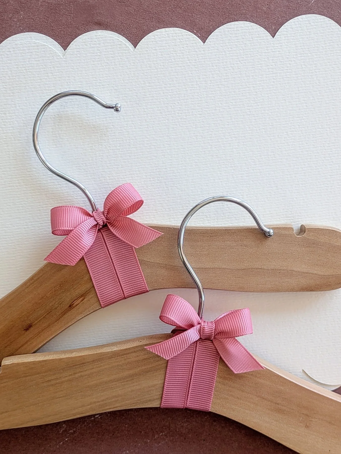 Custom baby clothes hangers are on the work table today, thoughtfully designed for your nursery. They are available in sets of ten, making them an excellent choice for baby shower gifts, or as individual hangers to pair with a new outfit. Visit our s