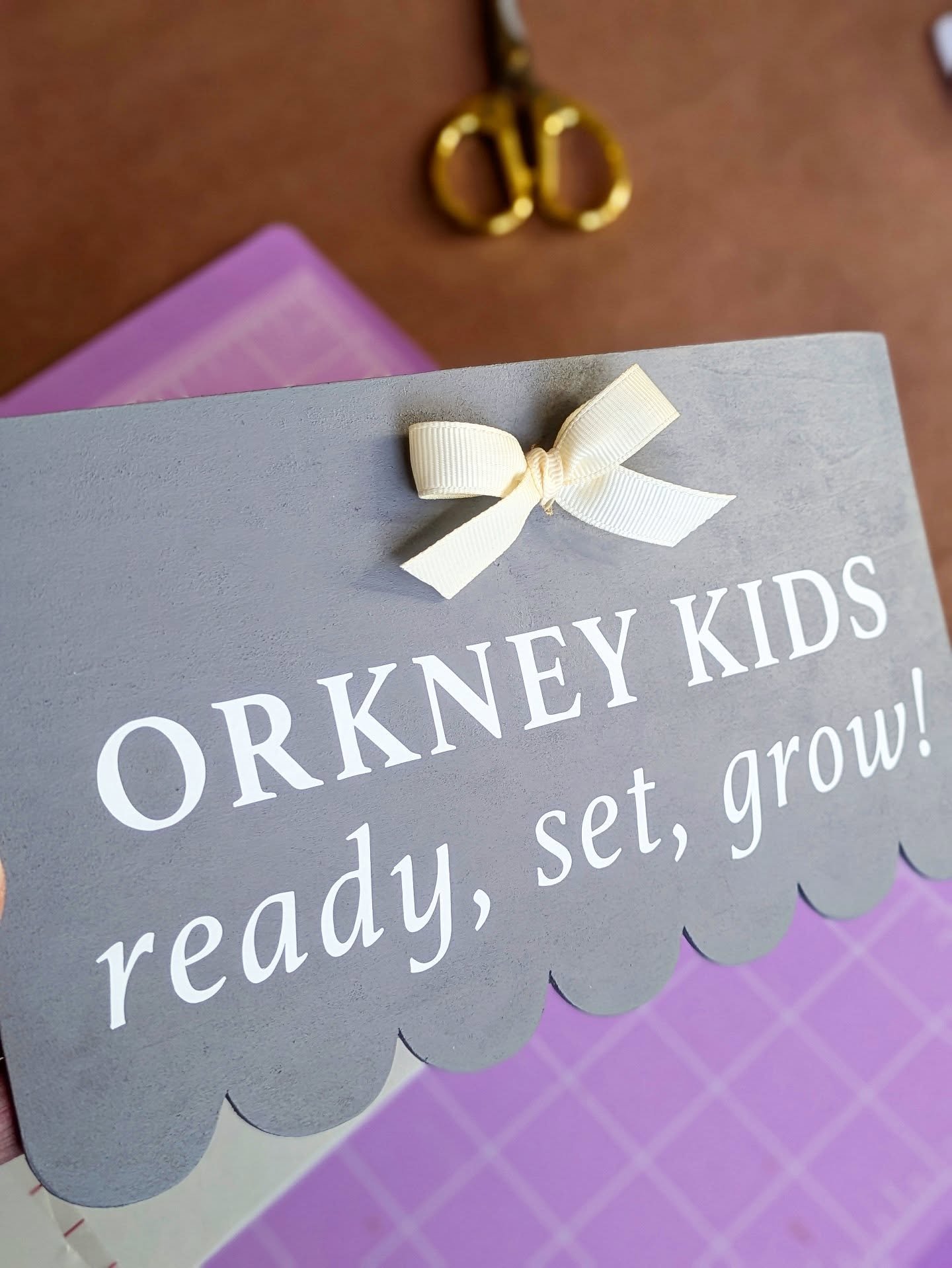 Every custom growth chart begins with careful brush strokes and precise vinyl lettering - then a perfectly hand-tied grosgrain bow completes the process. These aren&rsquo;t just rulers &mdash; they&rsquo;re heirlooms in the making, ready to hang and 