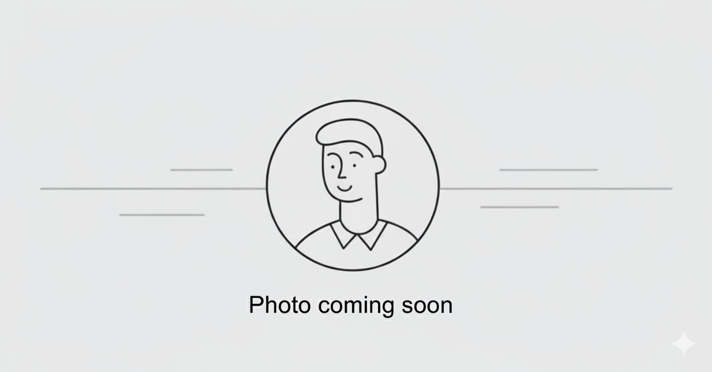 Placeholder image with a simple line drawing of a person's face, surrounded by a circle, with the text "Photo coming soon" beneath it.