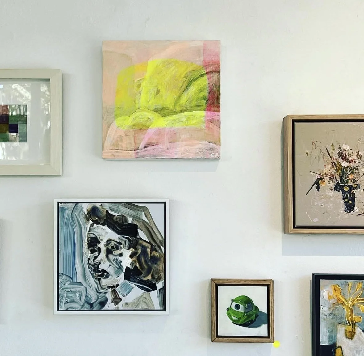 A gallery wall displaying various artworks, including an abstract painting . at saint cloche gallery paddington. contemporary artwork. modern art.