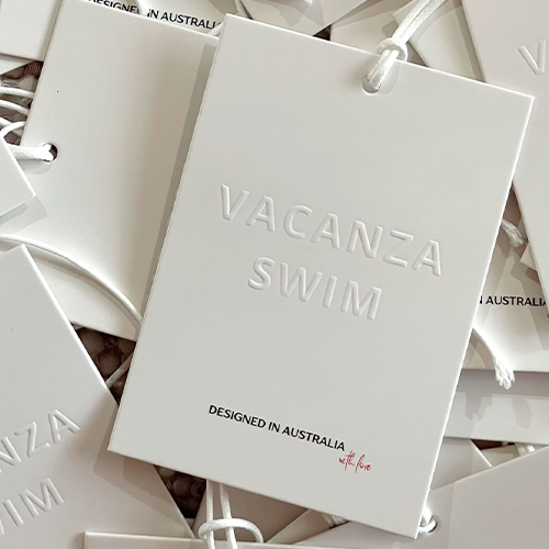 Swim tags designed for Vacanza Swim with embossed logo