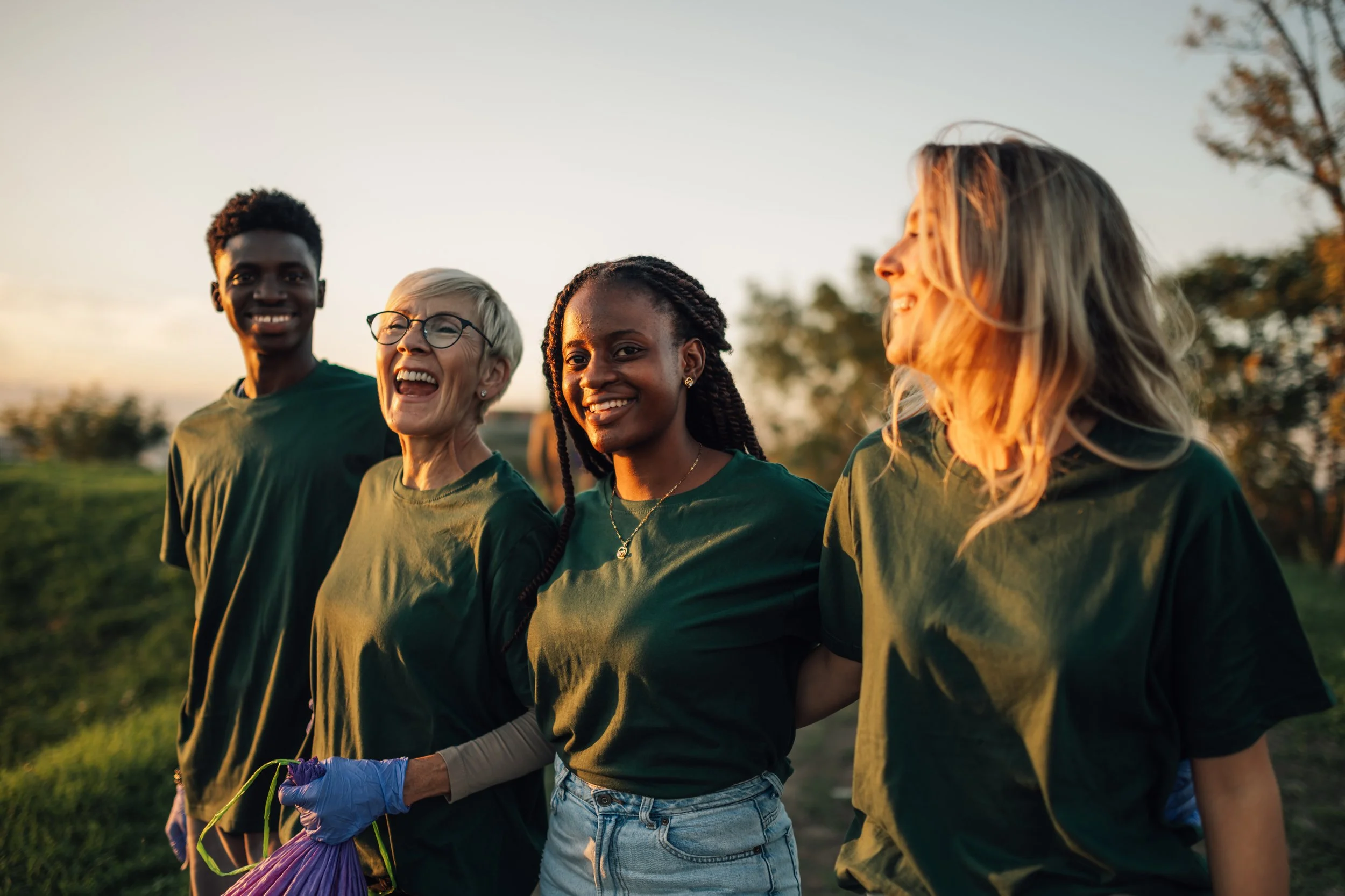 Group of community volunteers smiling outdoors