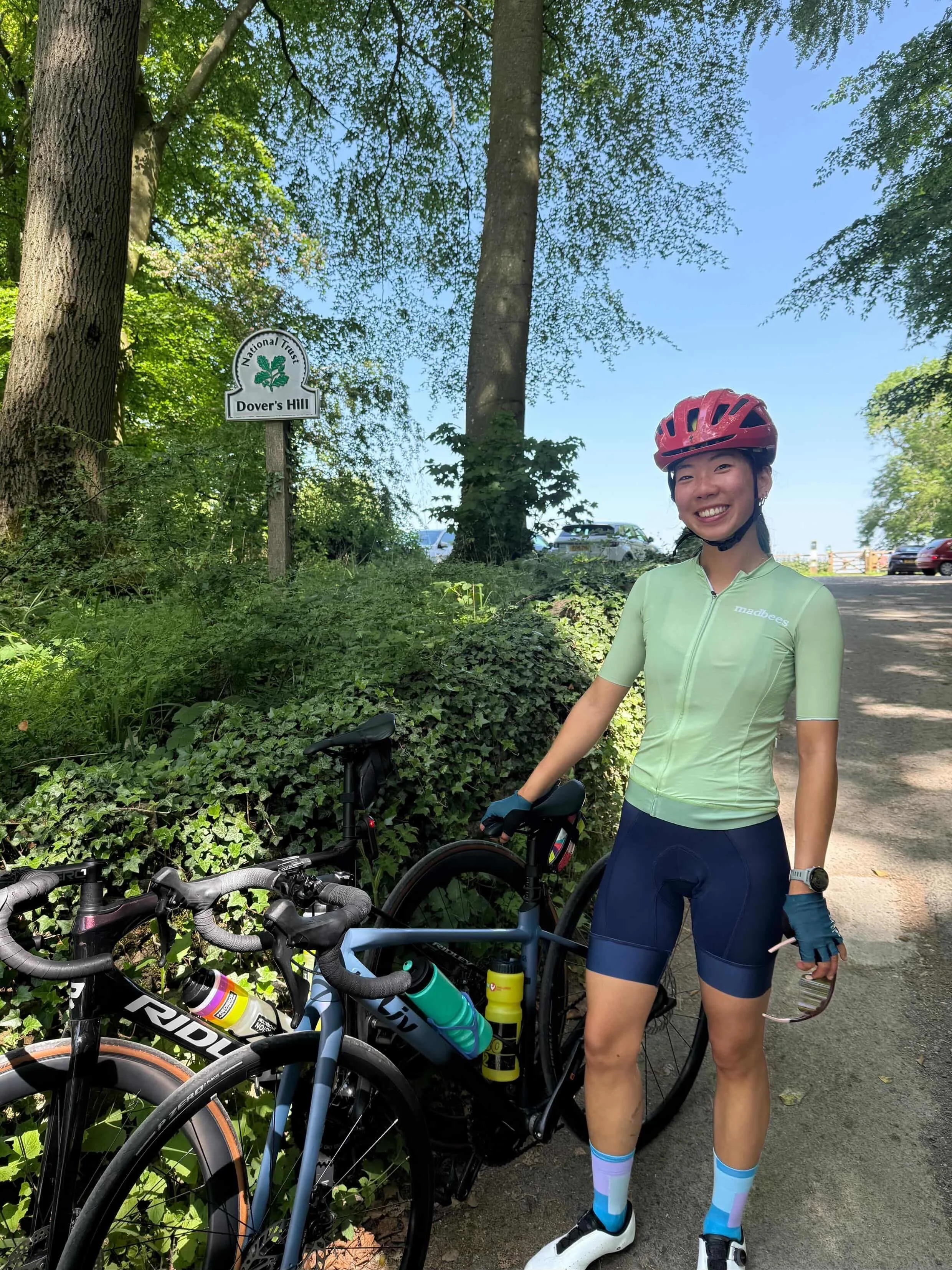 A woman cycling iin madbees gear