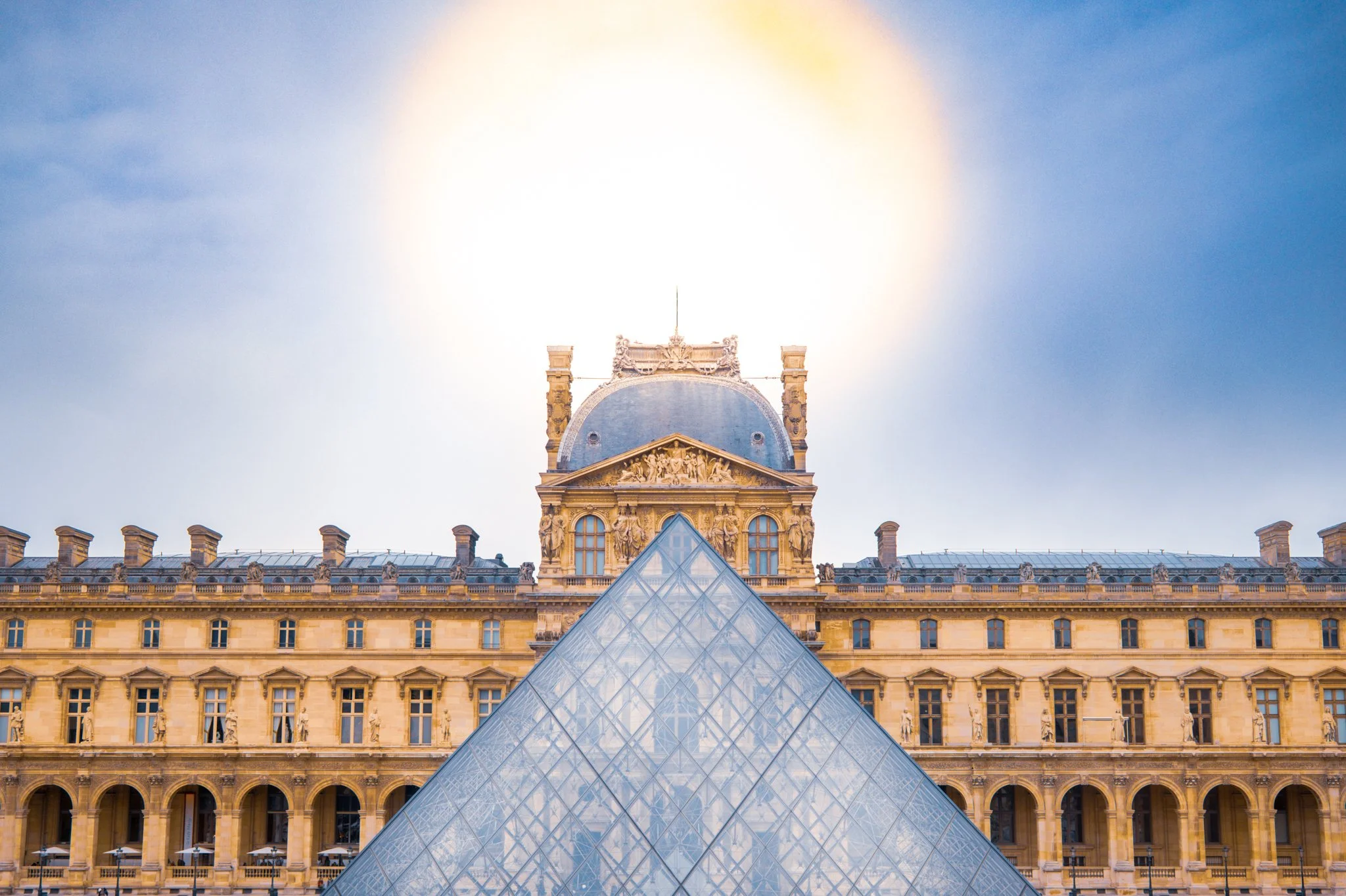 The Louvre Museum with glass pyramid in Paris, France.