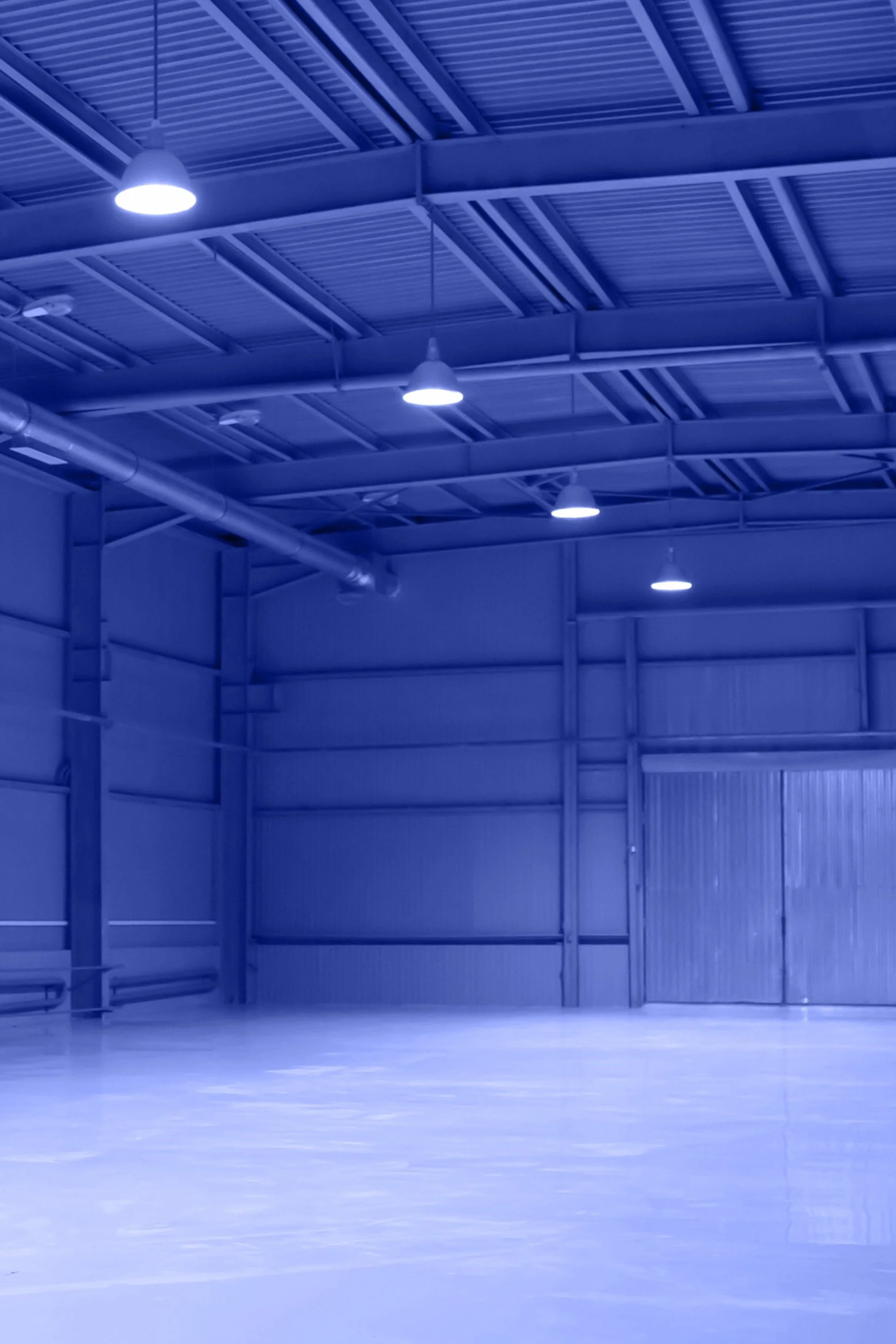 shutterstock_2577440657 dark warehouse.jpg