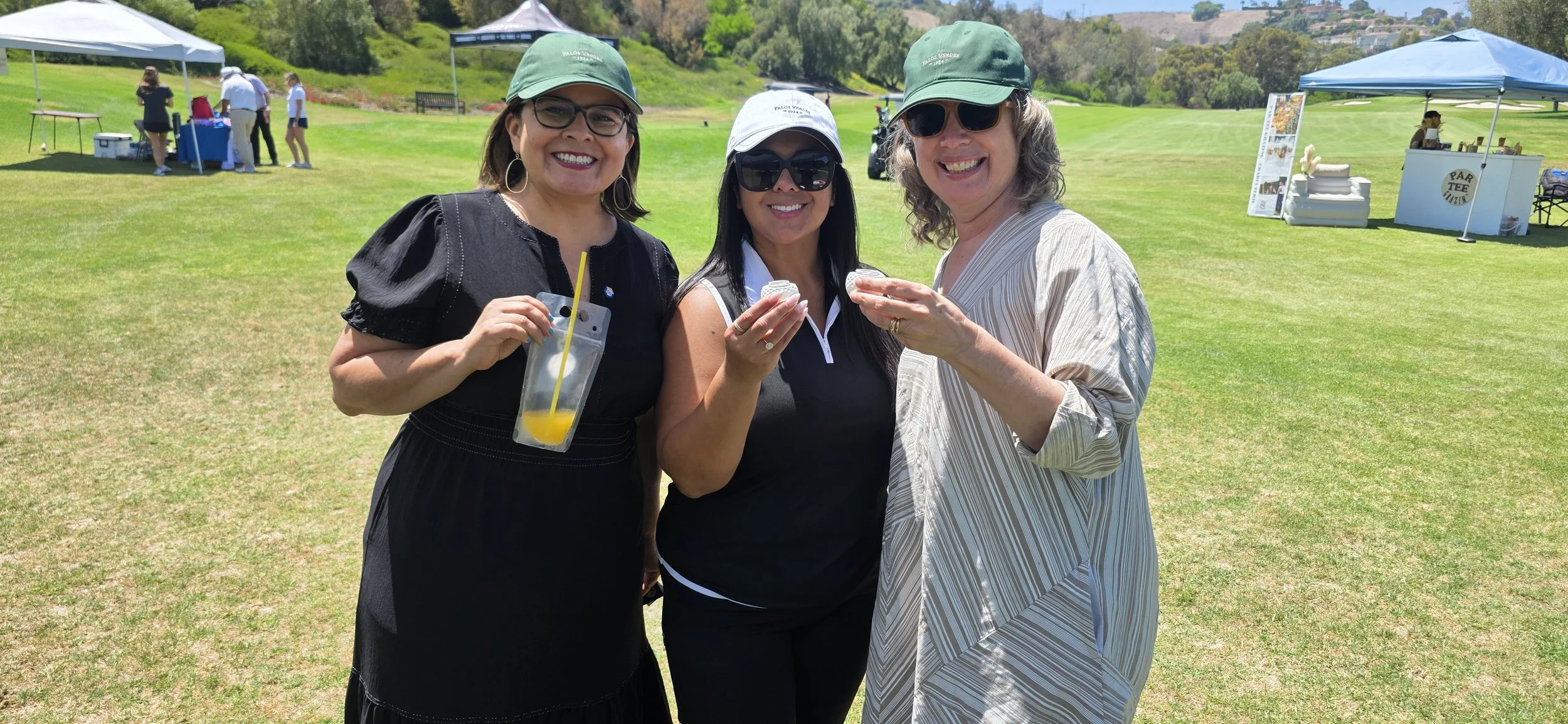Tournament guests posing at the Bad Birdie pop-up