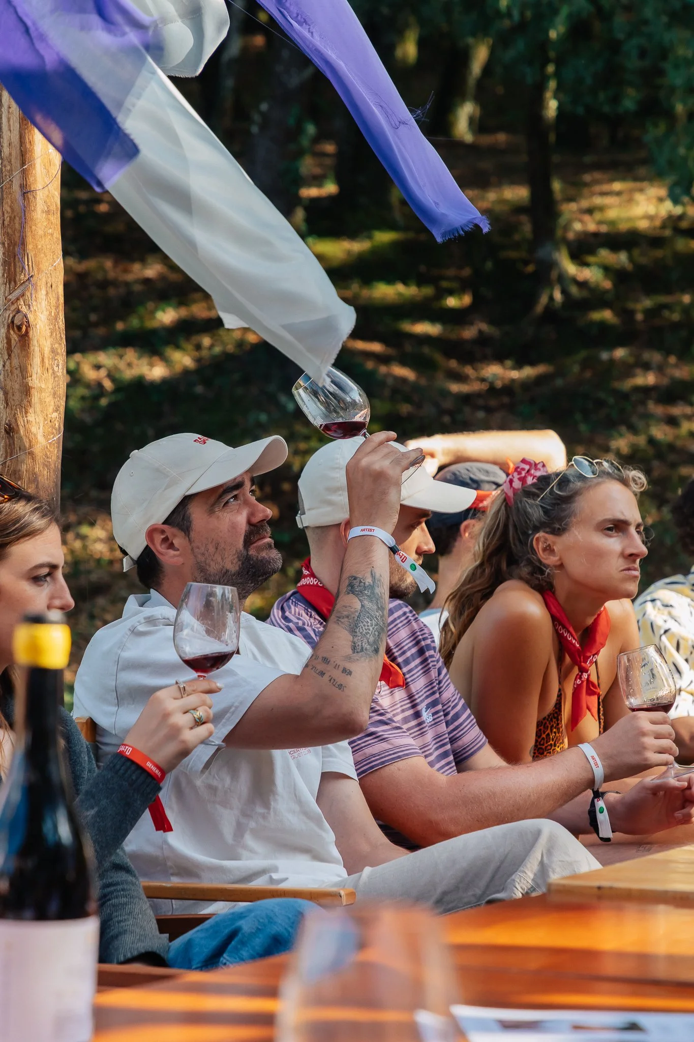 man looking at glass in wine tasting session