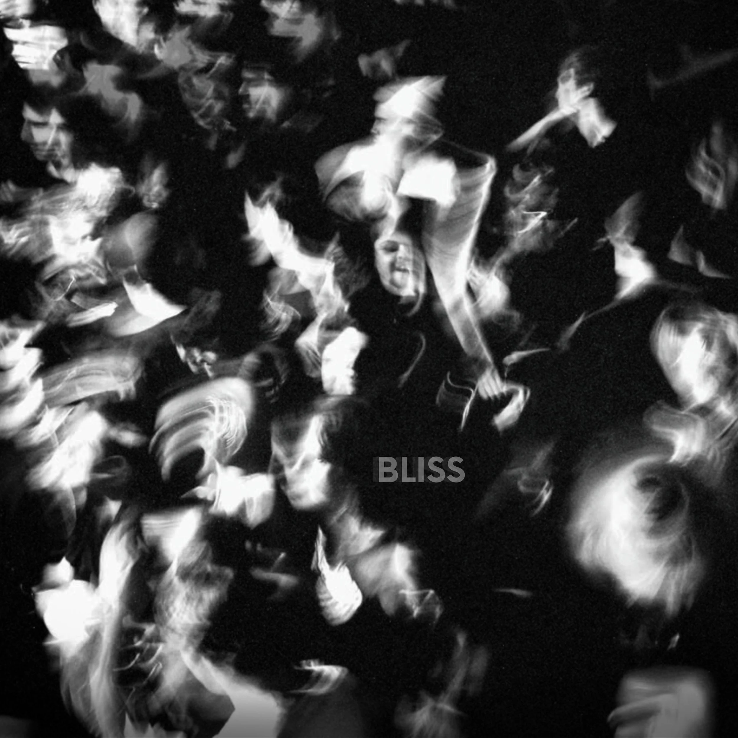 Black and white photo of a crowd of people, with one woman in the center smiling and raising her arm. The word 'BLISS' is written in the bottom middle of the image.