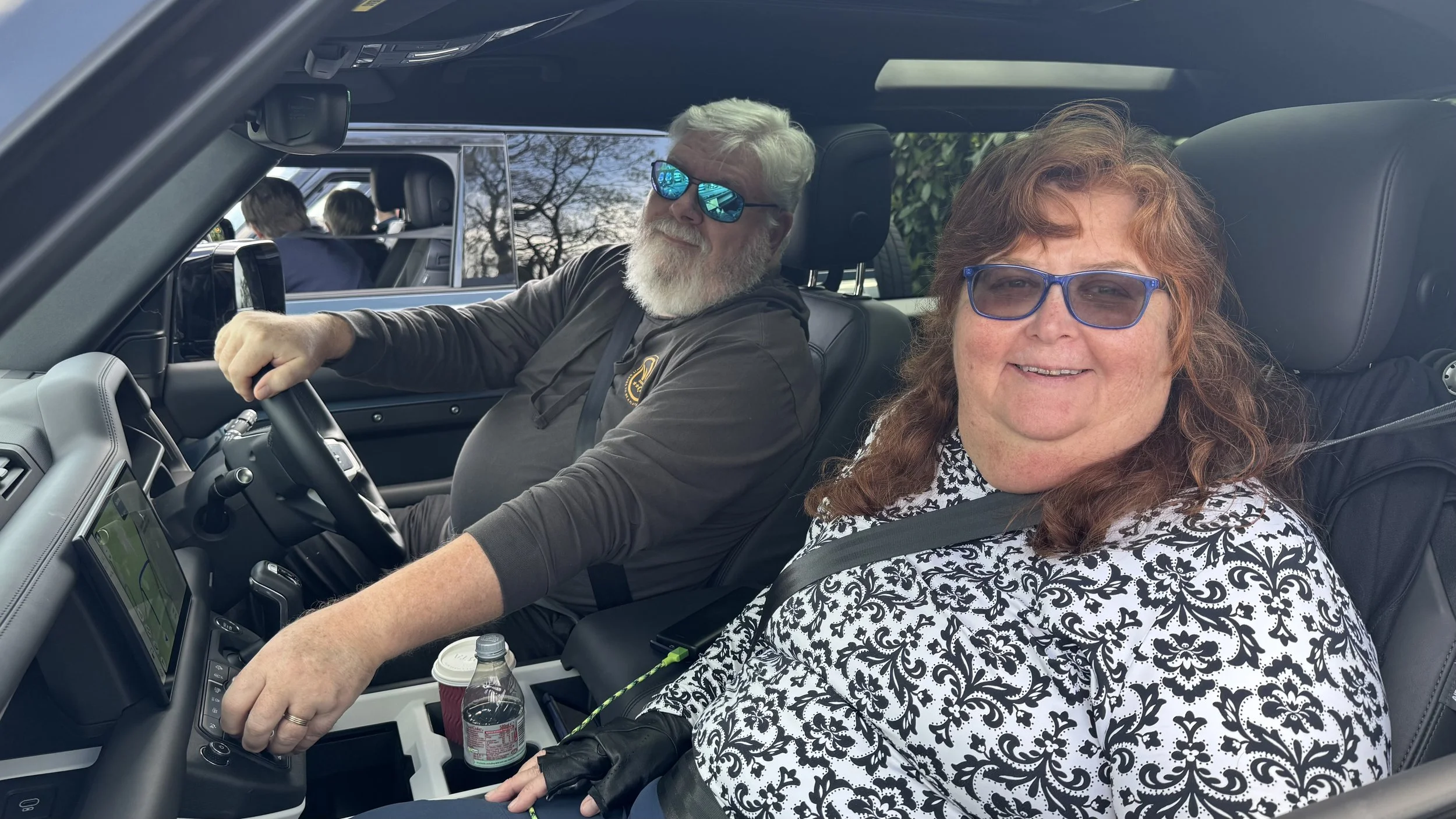  a couple of holiday makers sat in their land rover vehicle on a driving holiday 