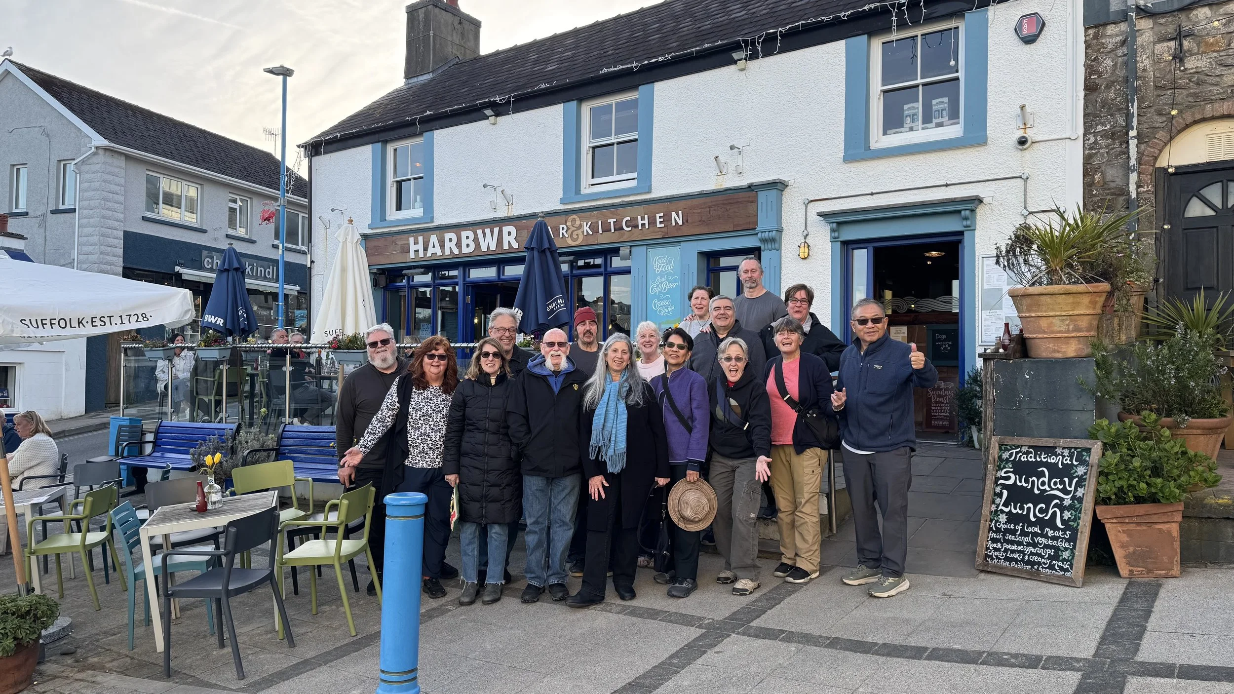  a group of holiday makers posing for a photograph in Saundersfoot 
