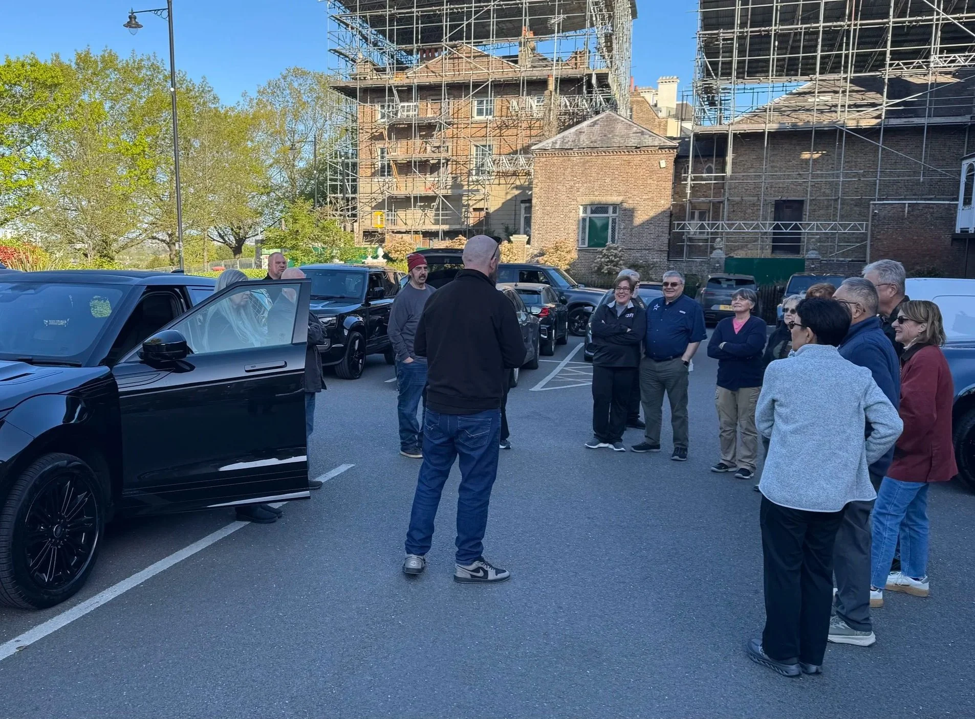  tour guide talking to guests on a driving holiday 