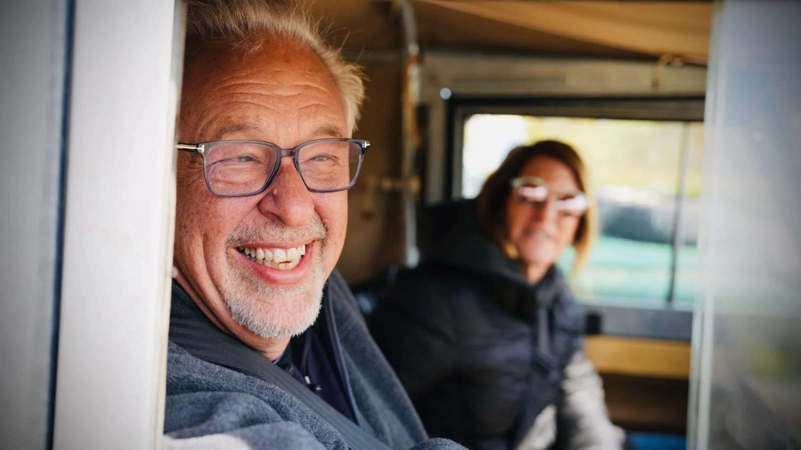  a photo of two holiday makers smiling 