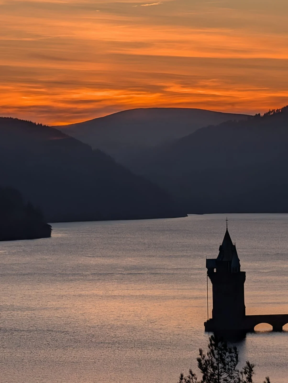  red sky sunset across a reservoir 