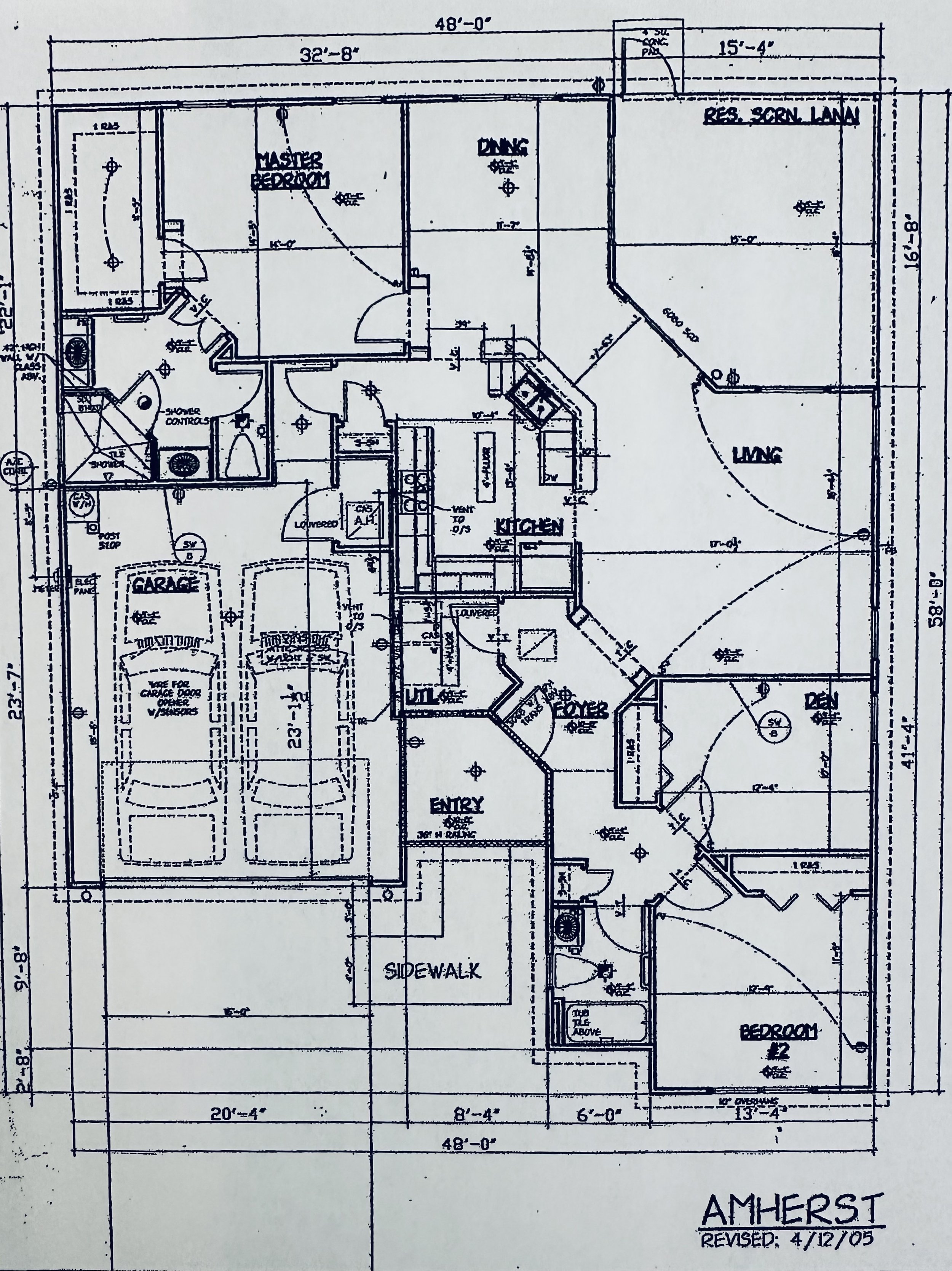Blueprint of a house labeled "Amherst" with a garage, master bedroom, dining area, kitchen, living room, entryway, den, and additional bedroom. The plan includes detailed measurements and layout dimensions. Revision date noted as 4/12/05.