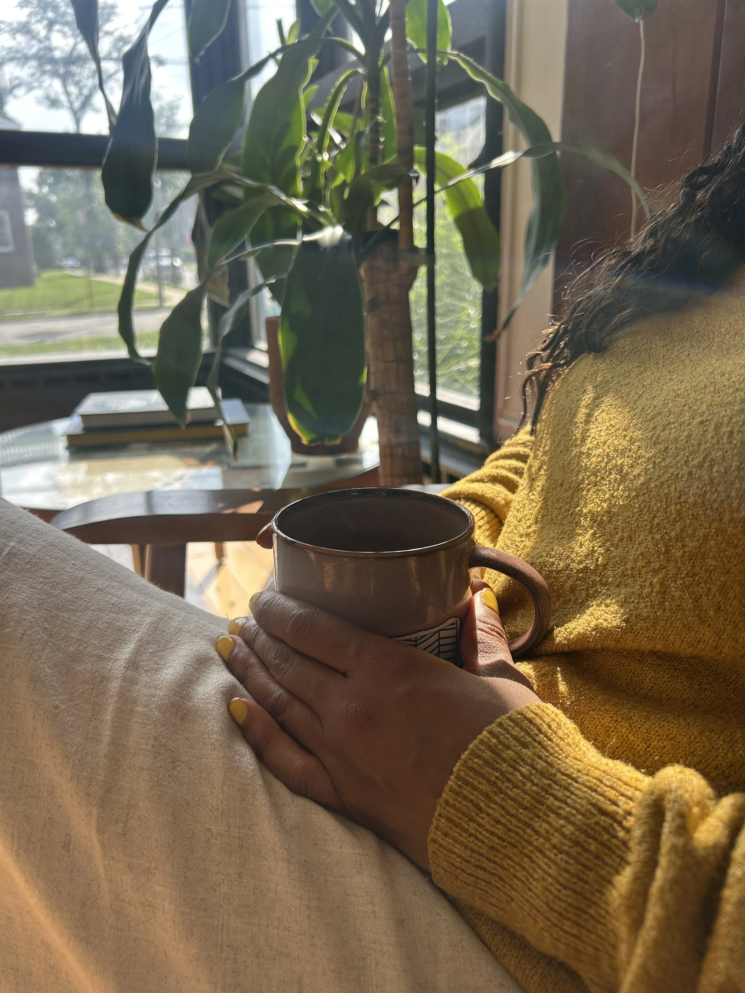 Founder Bashira sipping mushroom tea