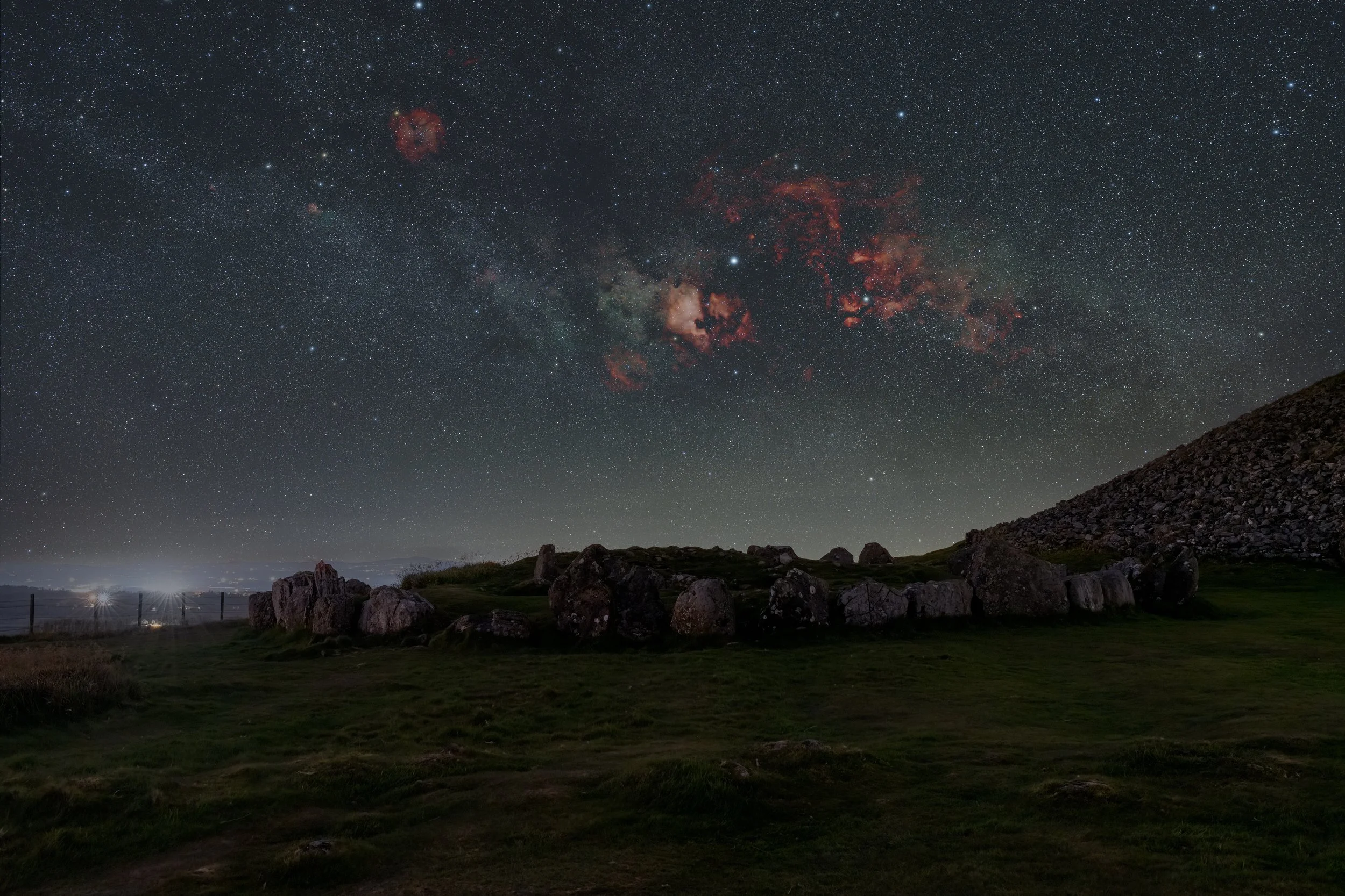 Loughcrew, Co. Meath — Cygnus and the summer Milky Way setting over a circle of standing stones on Slieve na Calliagh.