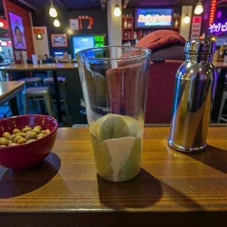 Green and Cream Shot Glass on a Bar.jpeg