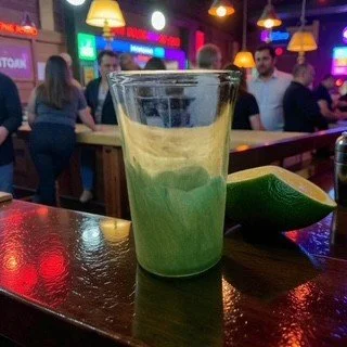 Lime Shot Glass on a Bar.jpeg