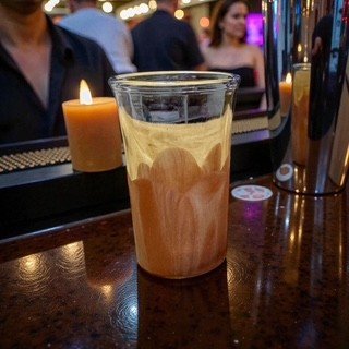 Caramel Ice Shot Glass on a Piano.jpeg