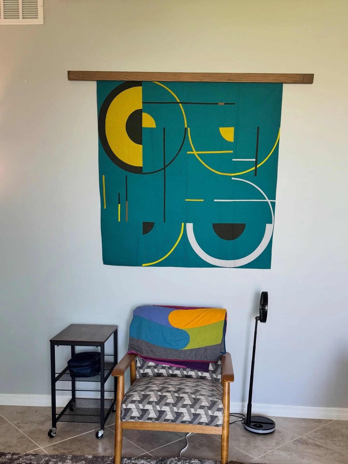 One major upside to clearing out and consolidating is that I found the art quilt I purchased from @marisawilhelmidesigns 

Doesn&rsquo;t it look great?