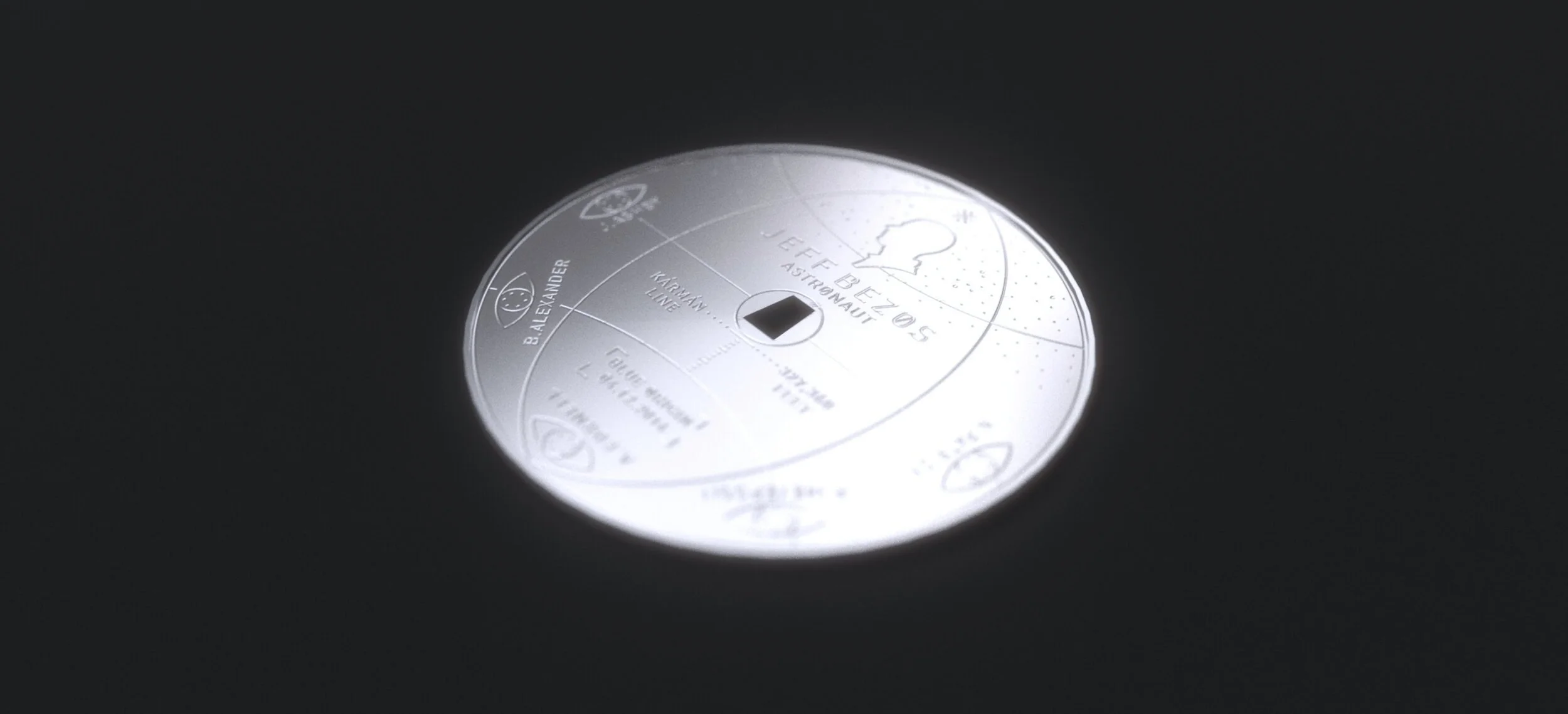 Close-up of a silver medallion featuring space-themed engravings and text, including "Kármán Line" and various names, set against a dark background.