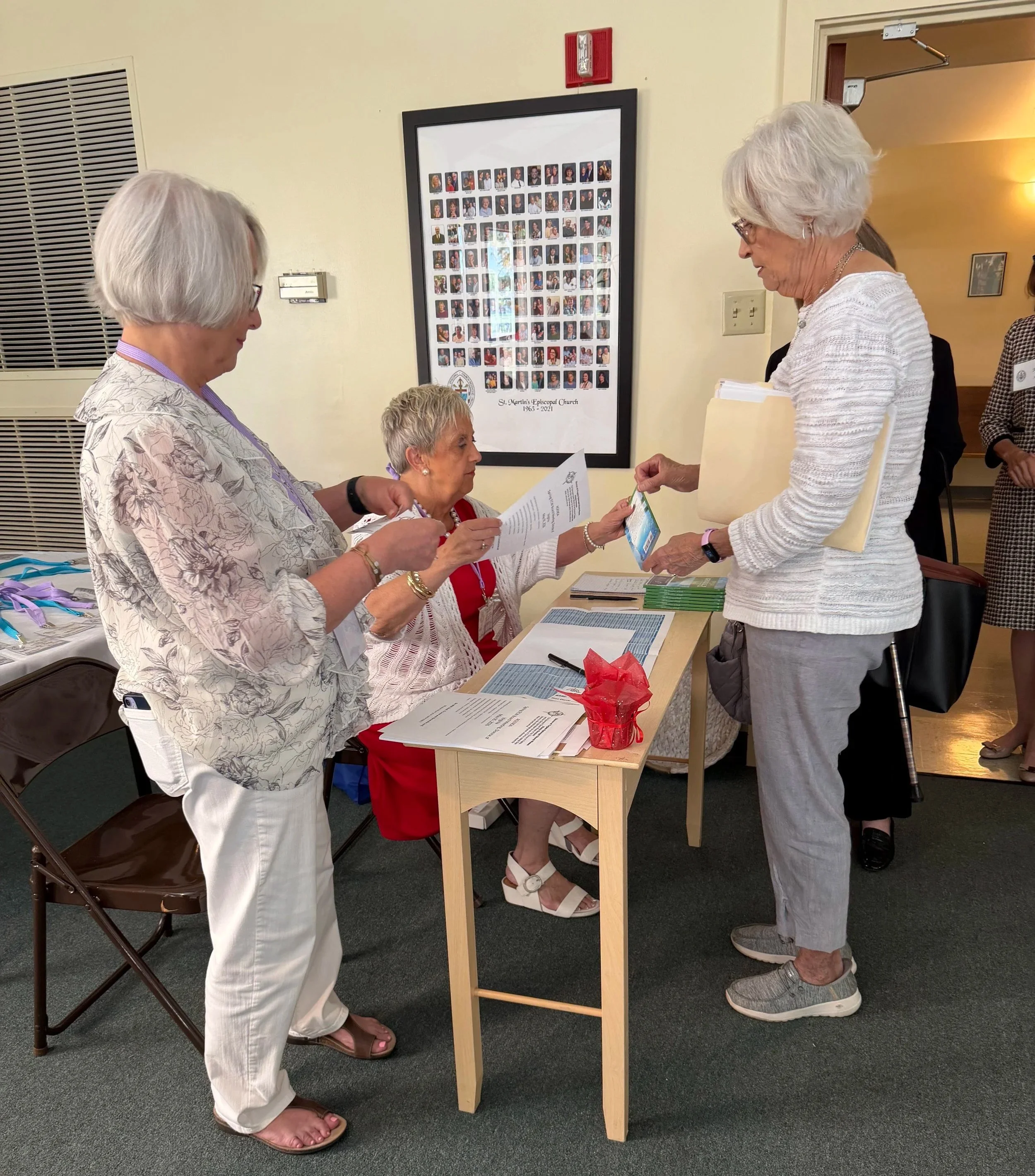 At the Check-In Desk: Kay Holmes, Cathy Saunders, and Kathy Jimerson