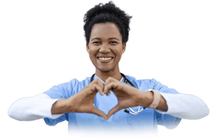 A female healthcare professional wearing blue scrubs and a stethoscope making a heart shape with her hands.