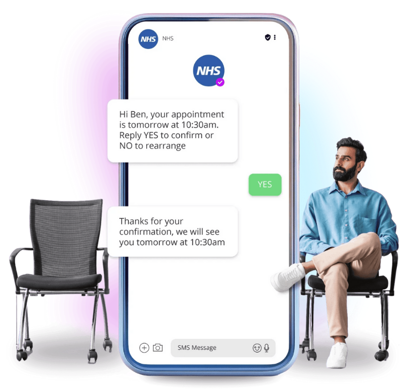 A smartphone screen displaying a messaging app conversation with NHS, confirming an appointment at 10:30 am. Two chairs on either side of the phone, and a man sitting on the right chair, with a purple and pink gradient in the background.