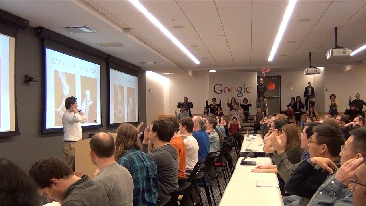 Andrew Gibbons teaching Google employees at a Tech Talk on Computer Posture.  