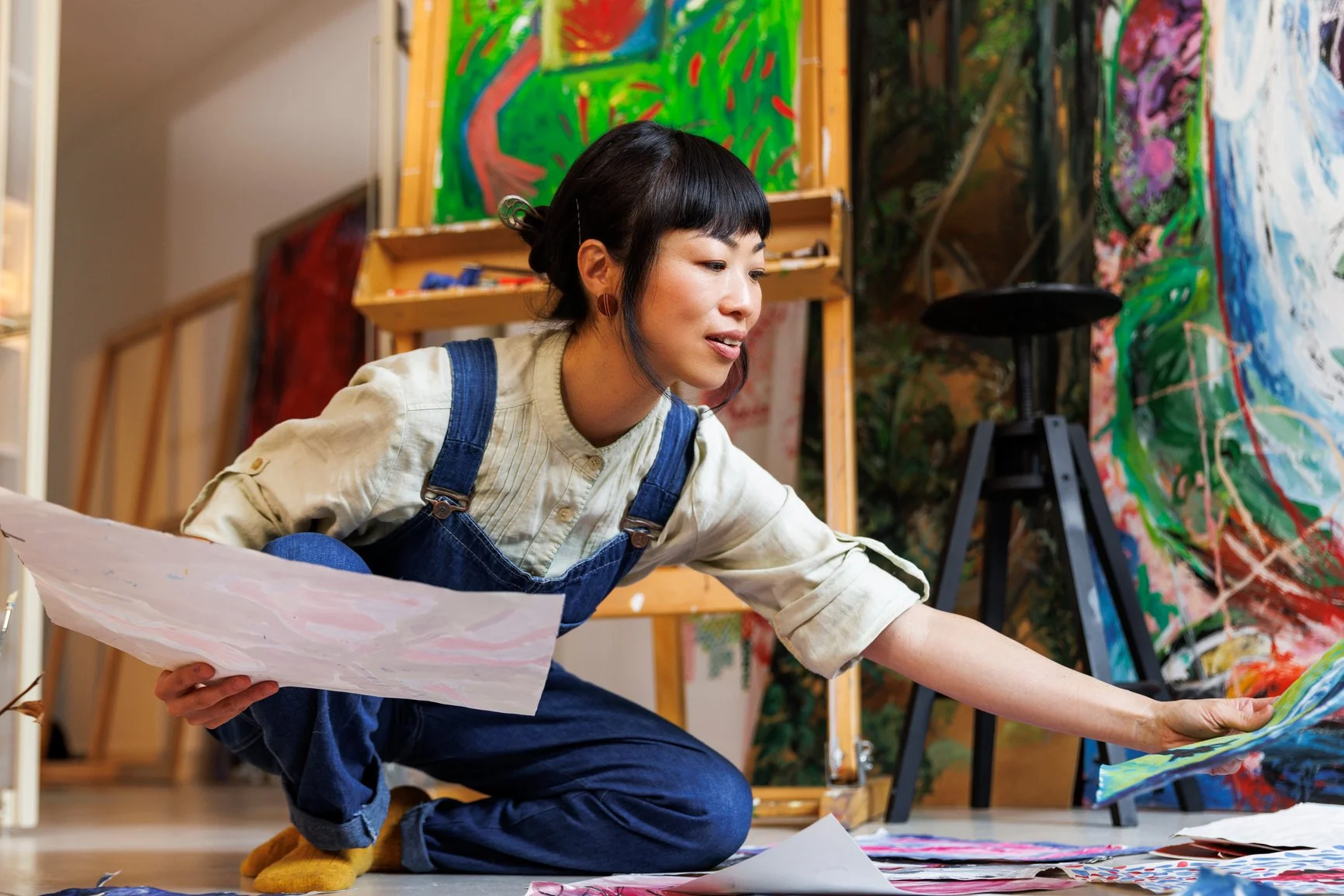 A Feldenkrais client finding elegance in reaching in her painting practice.