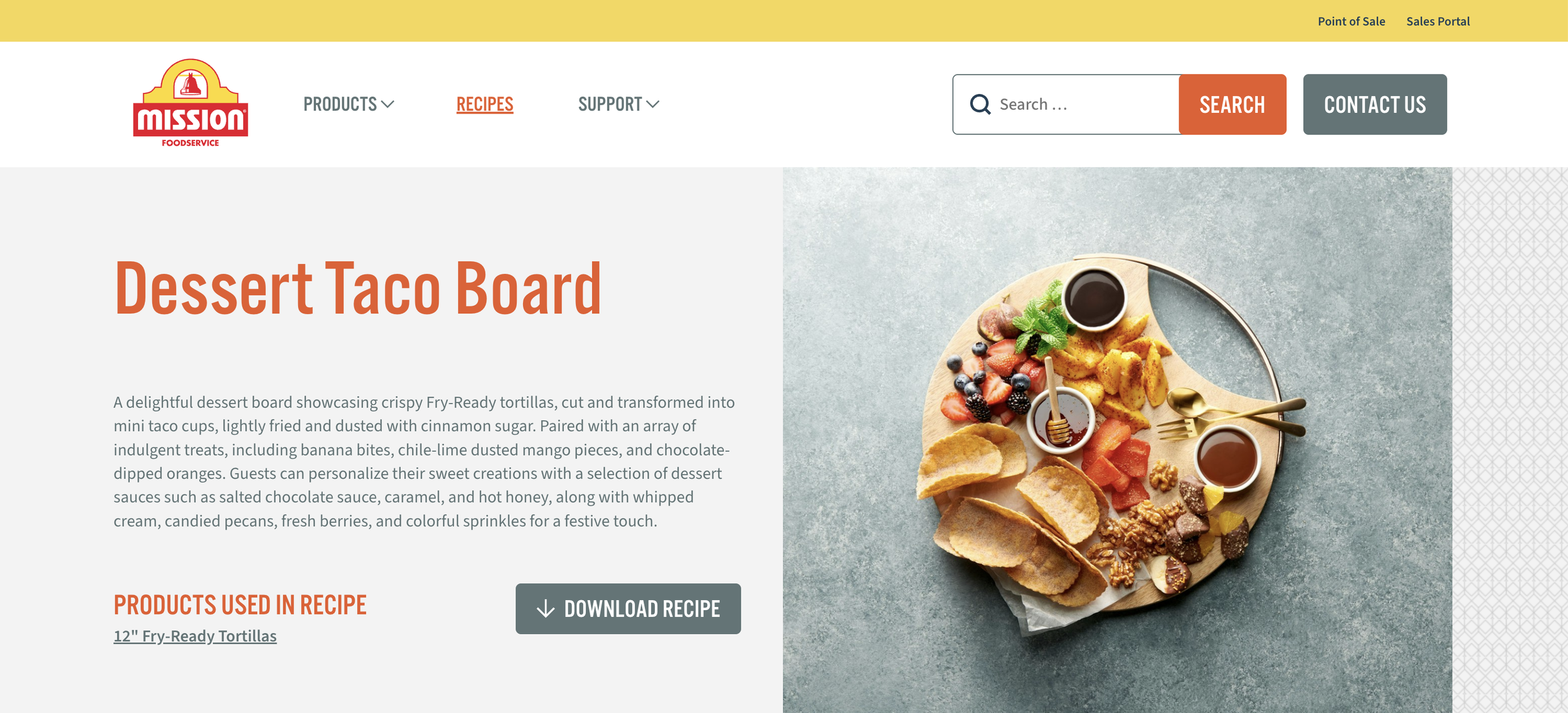 A webpage featuring a dessert taco board with crispy fry-ready tortillas, topped with various fruits, sauces, and treats, served on a round wooden platter with gold utensils.