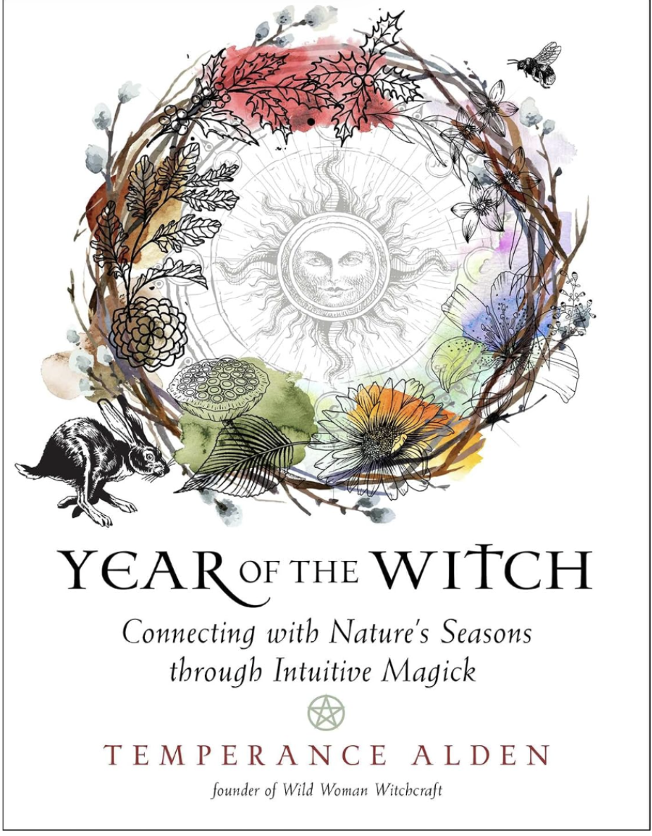 Book cover for 'Year of the Witch' by Temperance Alden, featuring a decorative wreath with leaves, flowers, a rabbit, a bee, and a sun face, with watercolor accents.