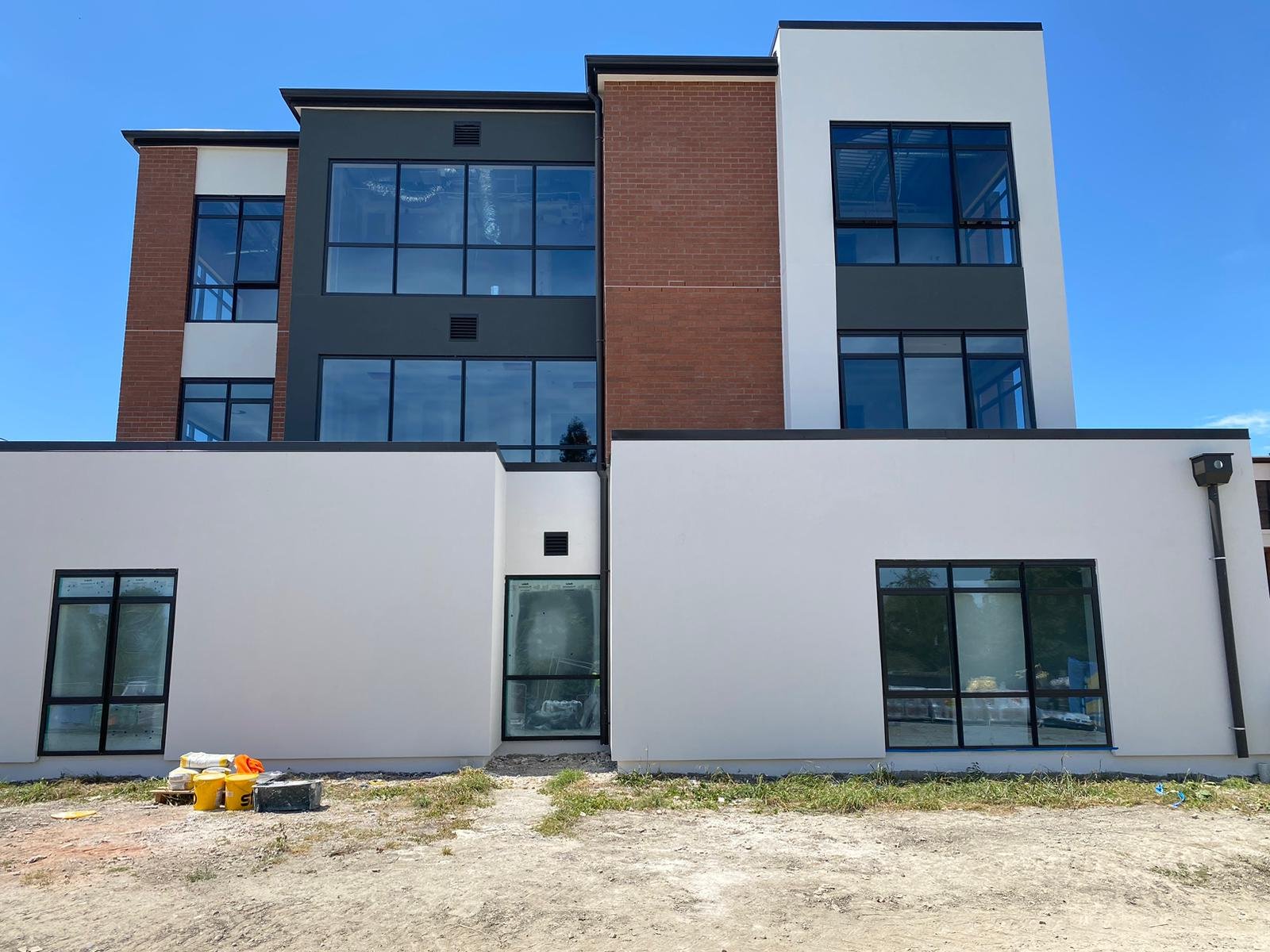 After the exterior plastering and cladding installation in this retirement village, the clean and modern finish, paired with a fresh coat of paint, creates a sleek, durable surface for the long term.