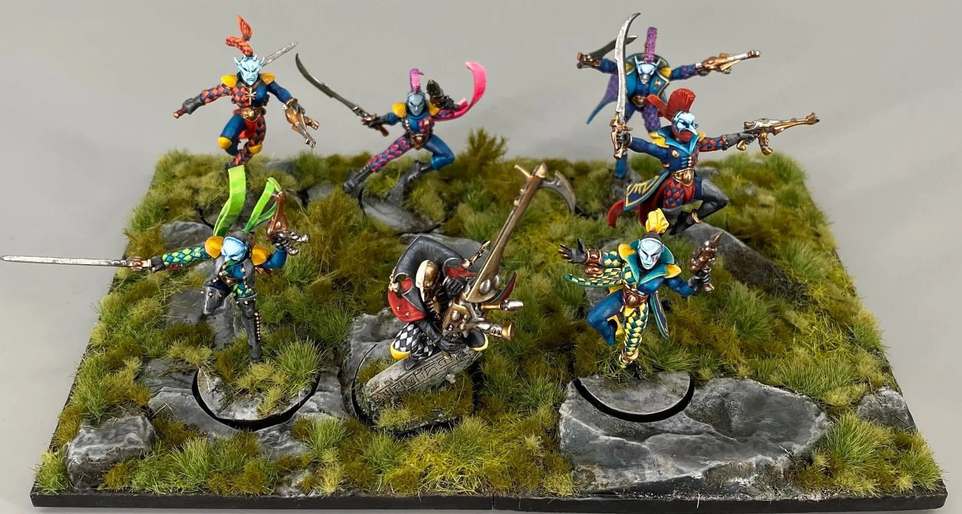 Harlequin troupe on decorative base