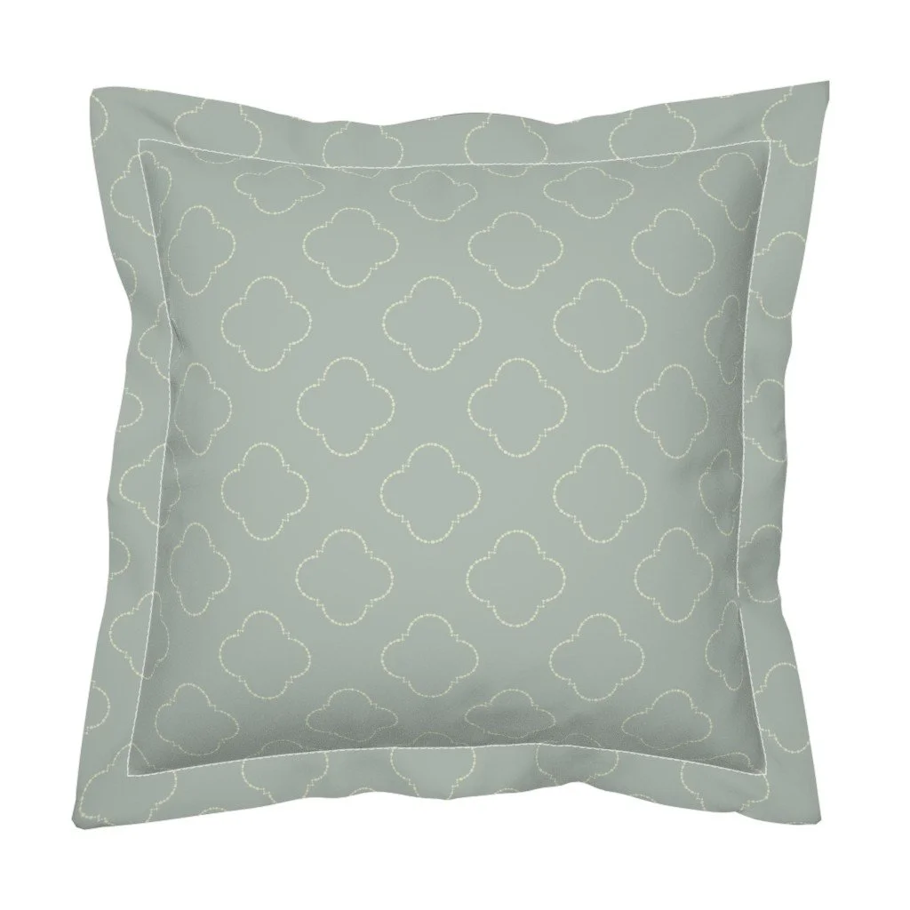 Inspired by Spanish architecture, this simple half-drop features beaded quatrefoils